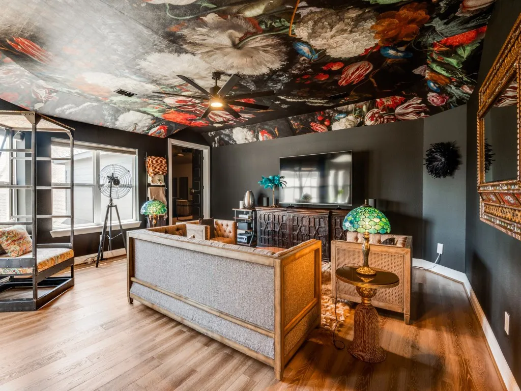 Living room featuring a ceiling fan and wood finished floors