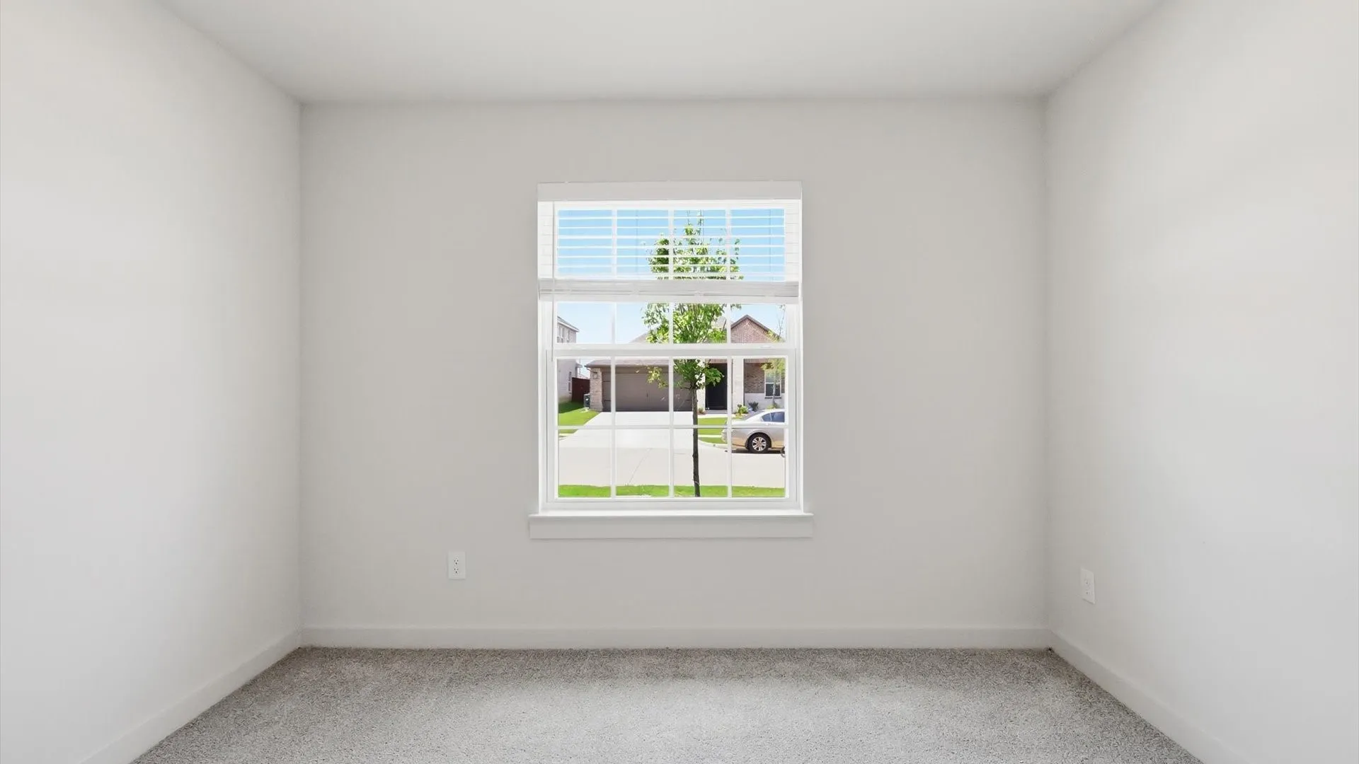 Interior room featuring light gray carpeting and white painted walls