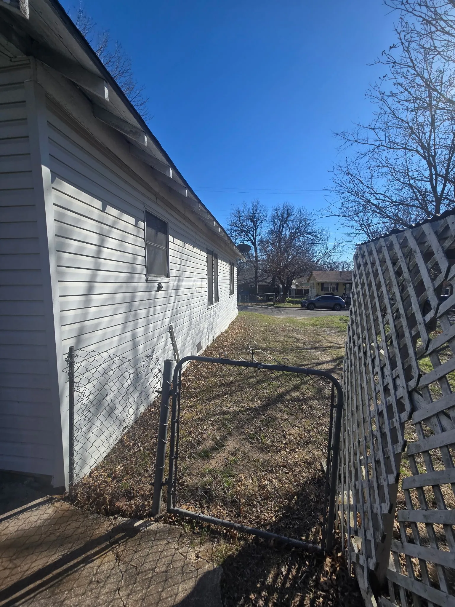 View of home's exterior featuring a gate
