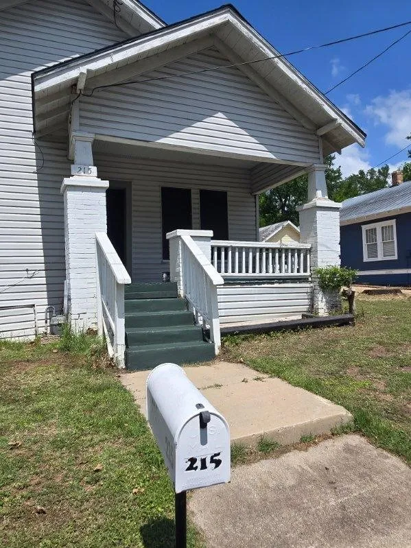 Inviting front porch with classic railings and steps