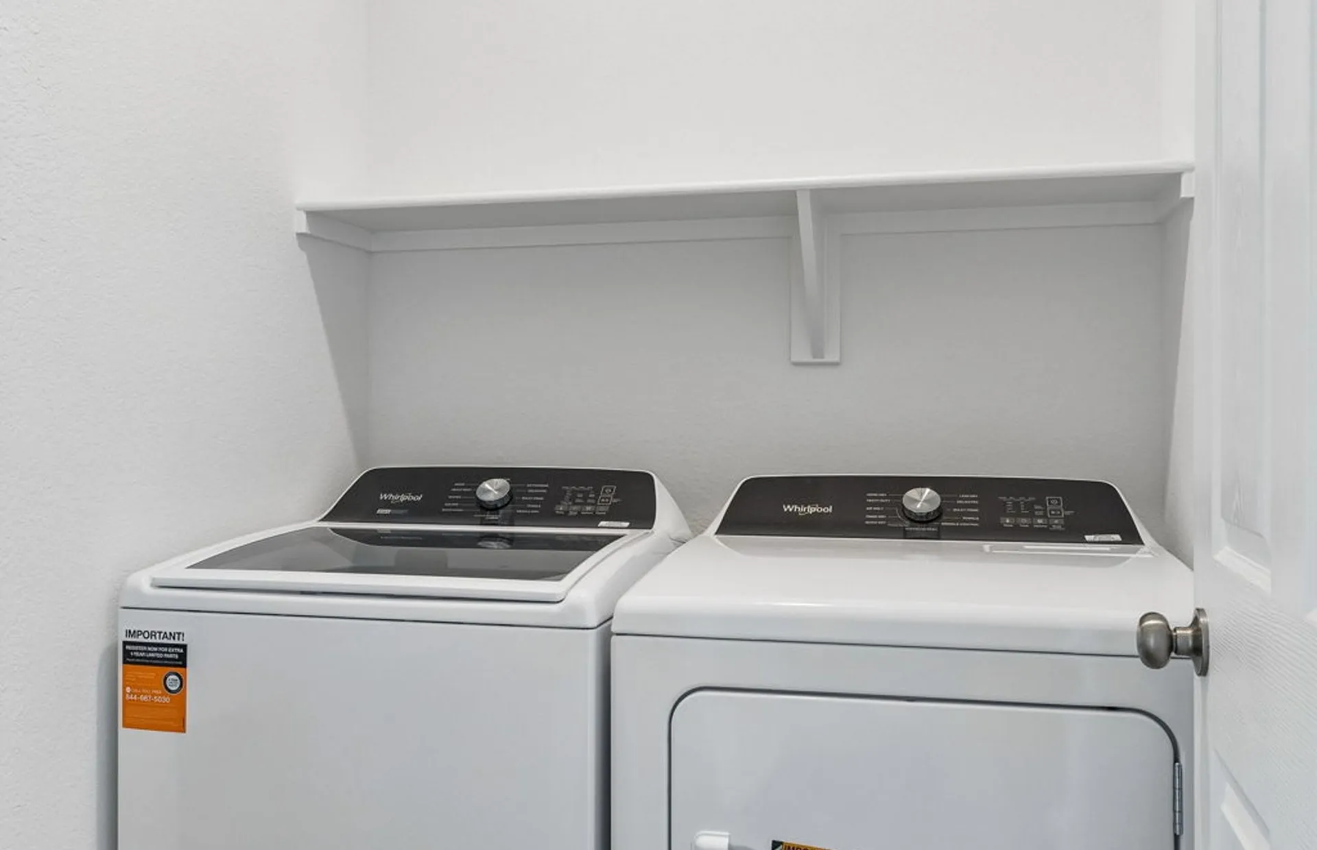 Laundry room with built on shelving