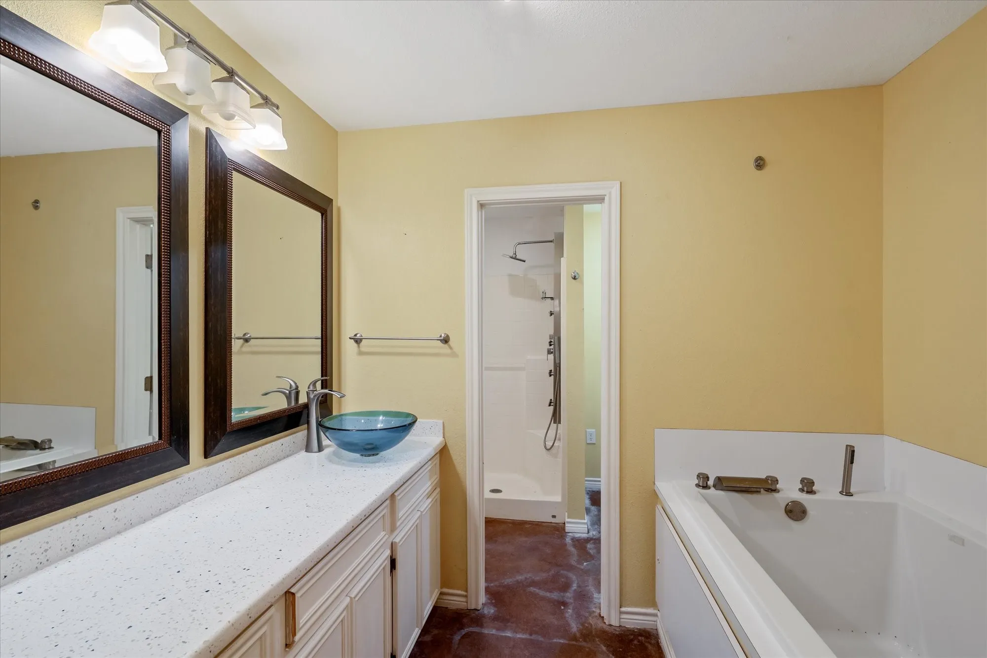 Full bath featuring a garden tub, vanity, and a stall shower