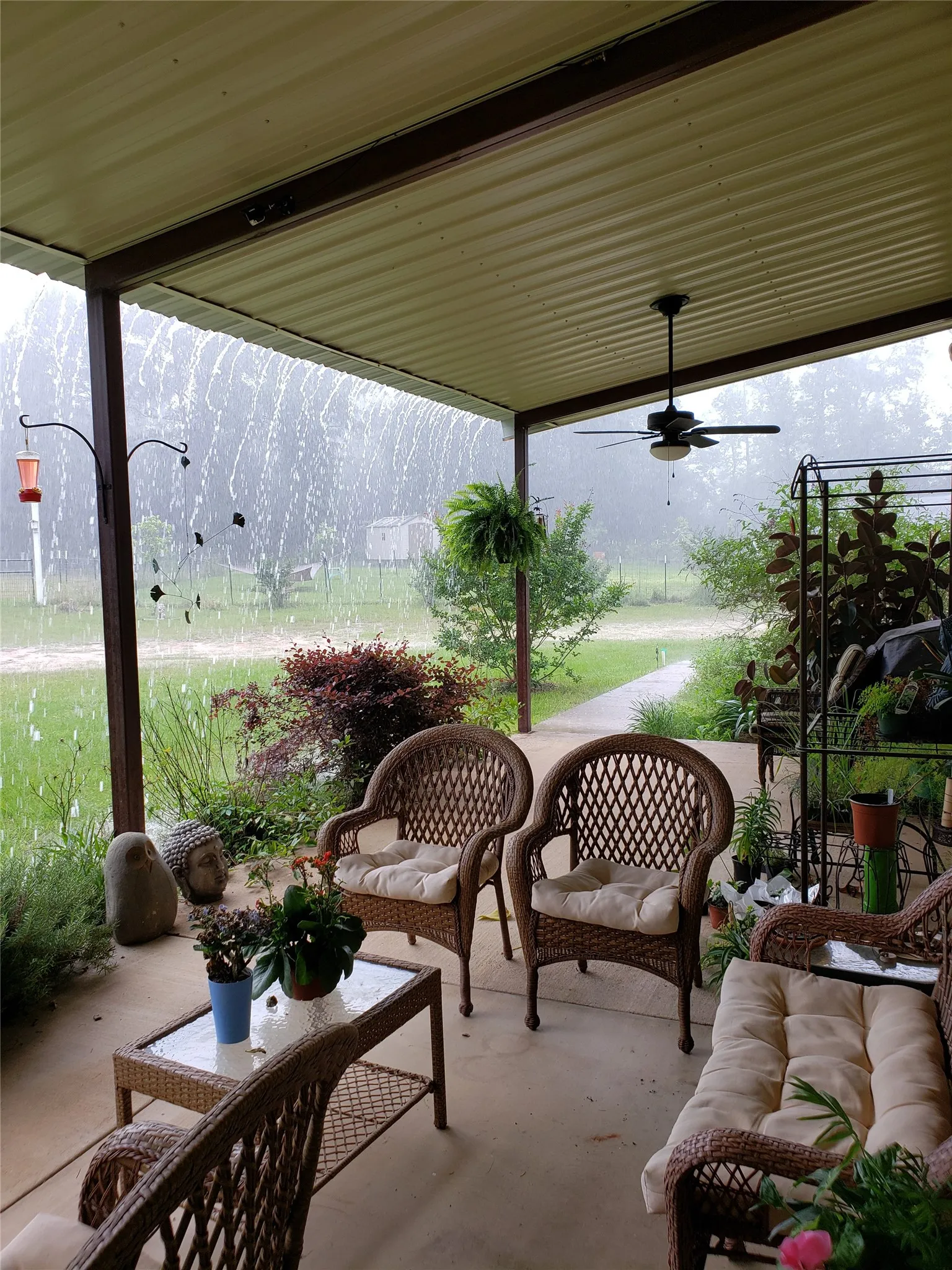 View of patio featuring a ceiling fan