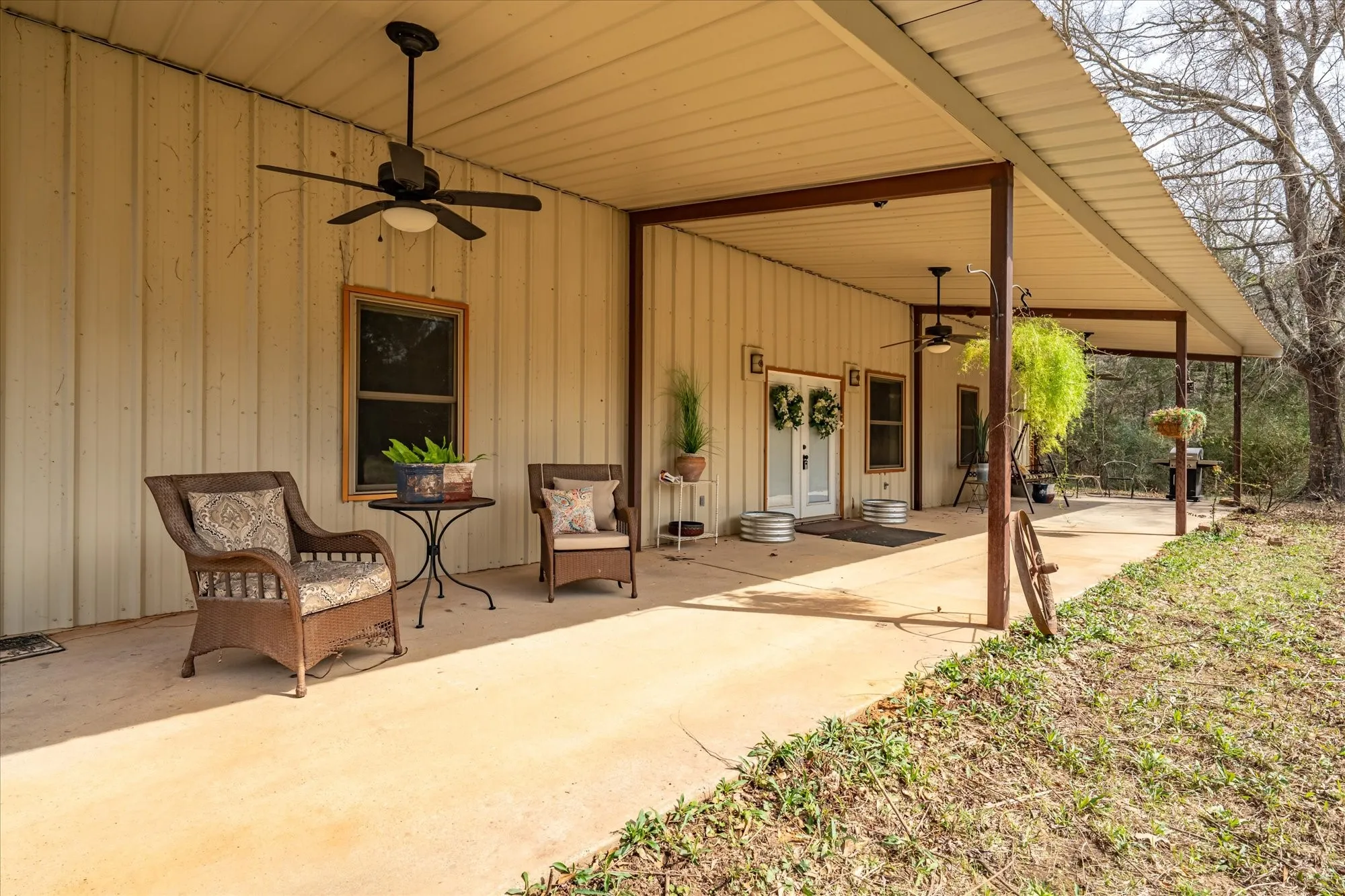 View of patio with a ceiling fan and french doors