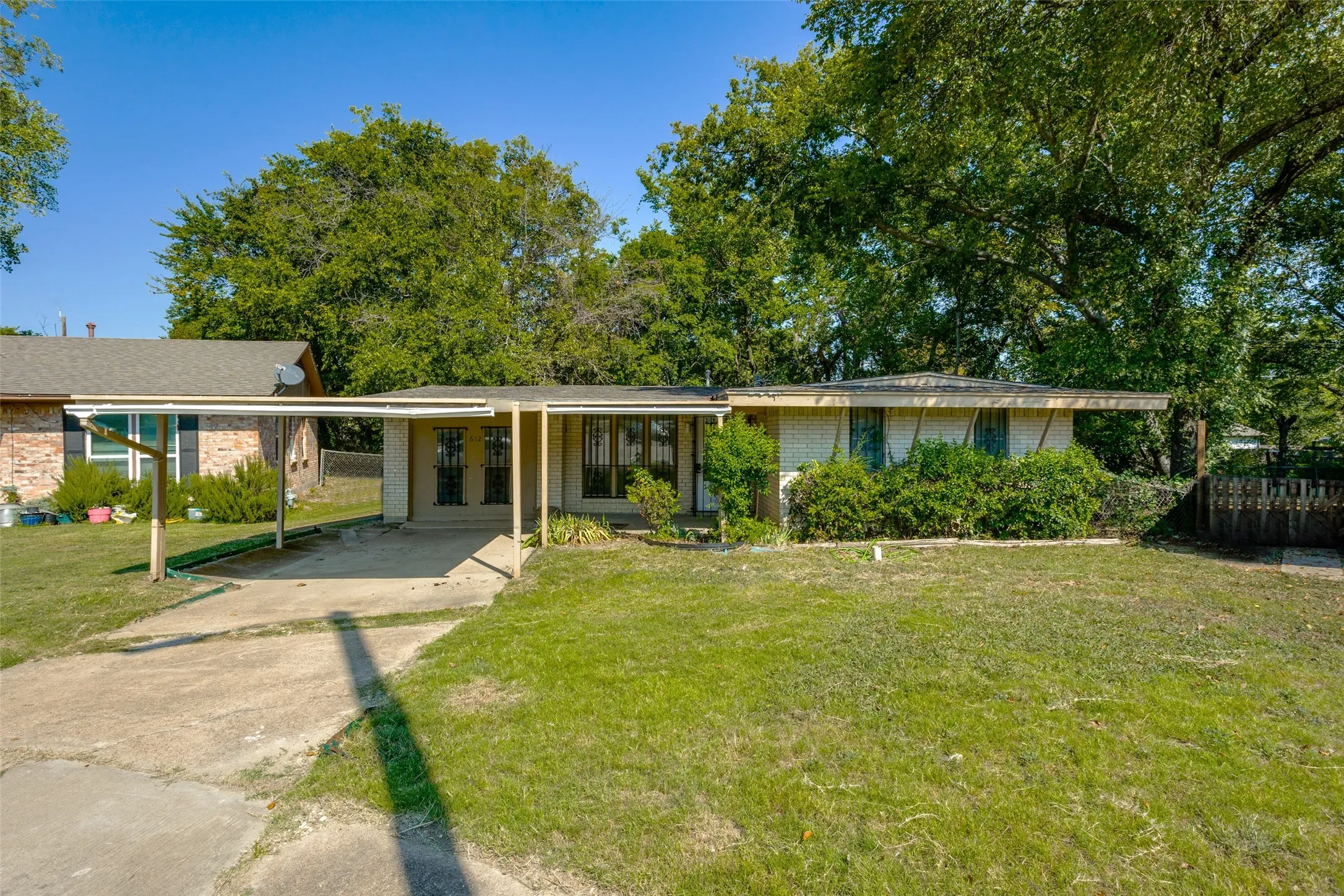Front of the house with the two car carport.