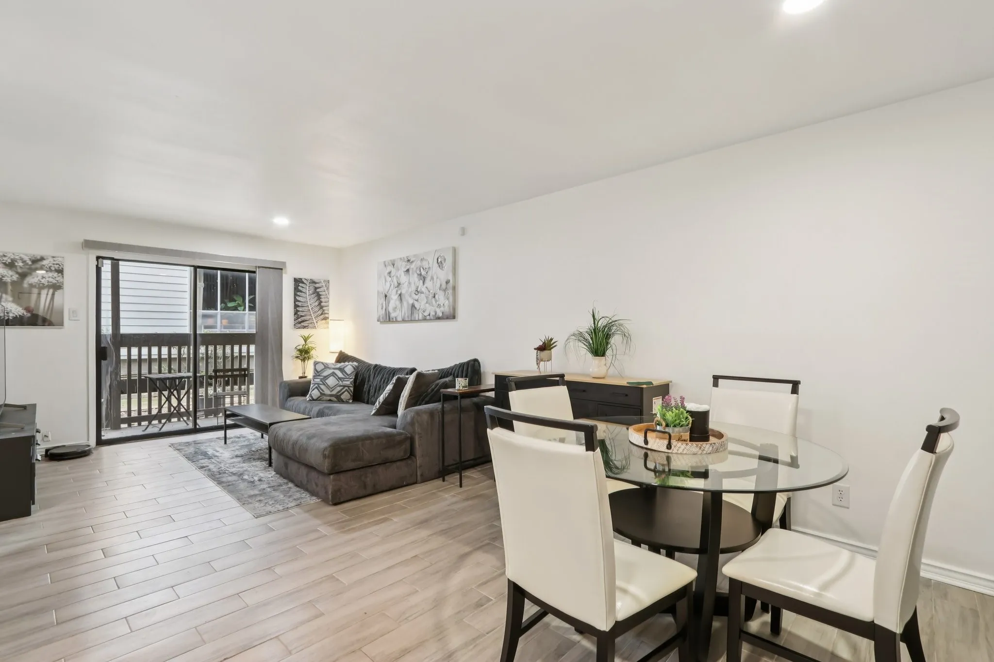 Dining space featuring recessed lighting and light wood-style tile flooring