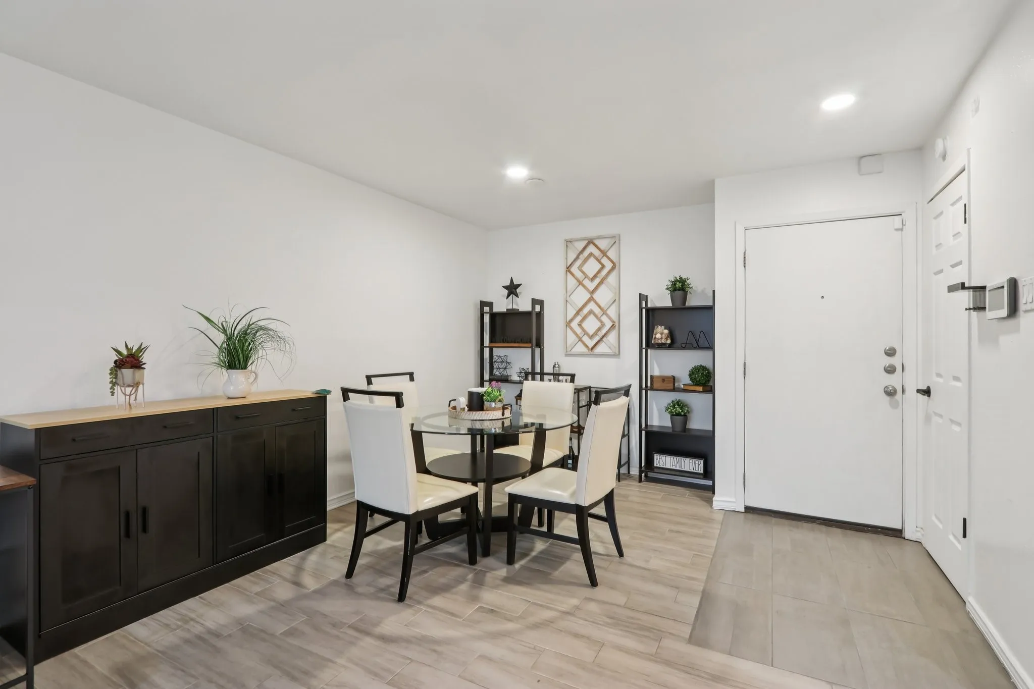Dining room with recessed lighting and light wood finished floors