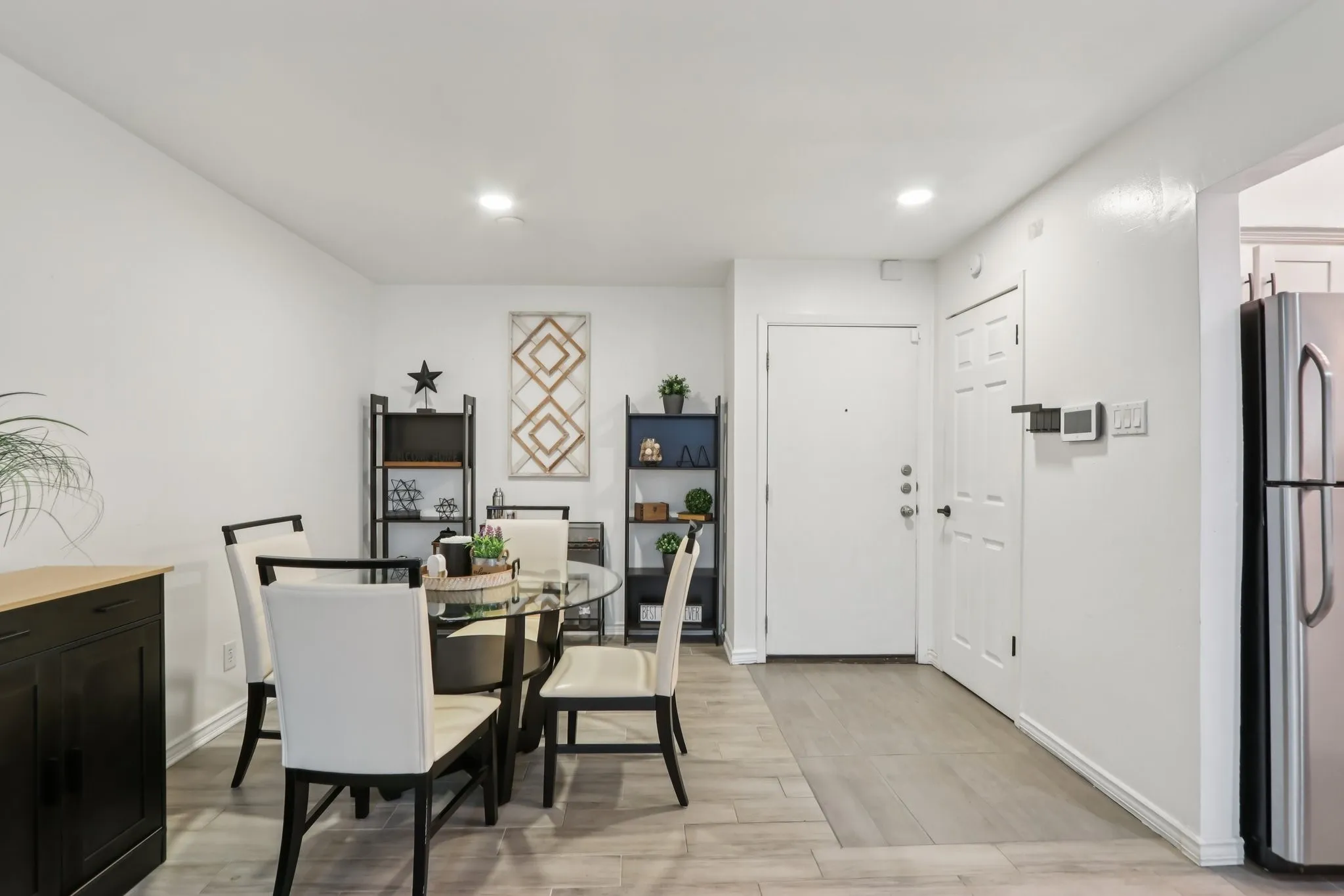 Dining space featuring light wood-style floors and recessed lighting