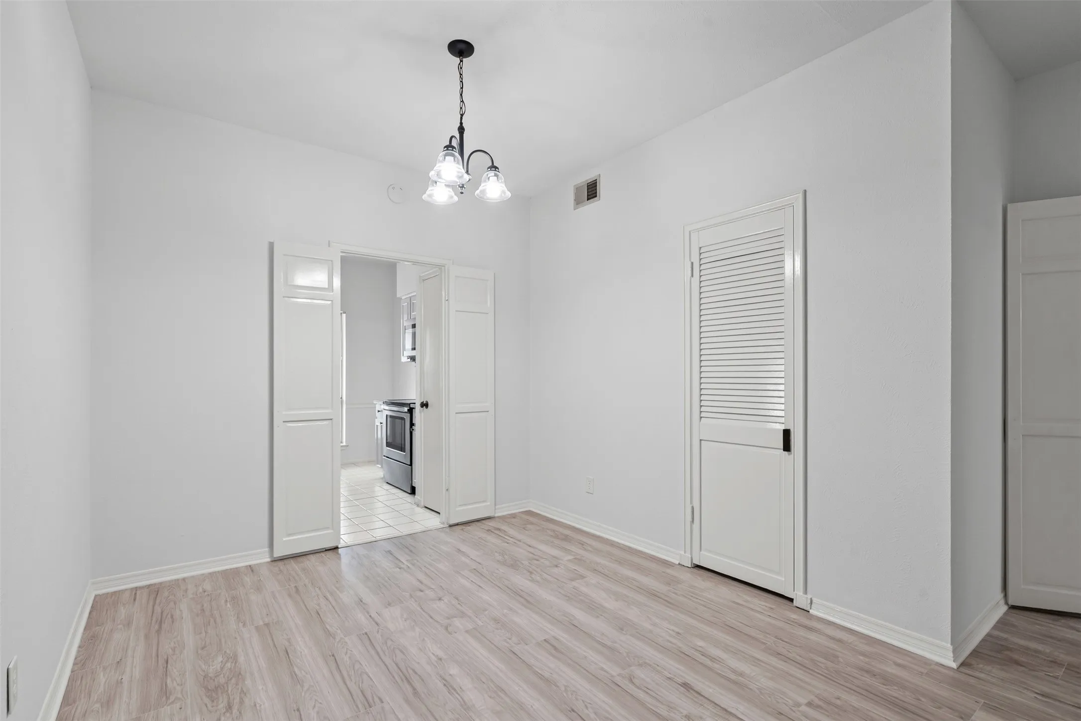 Dining area with storage closest. This is the original photo used for the virtual staging photo.