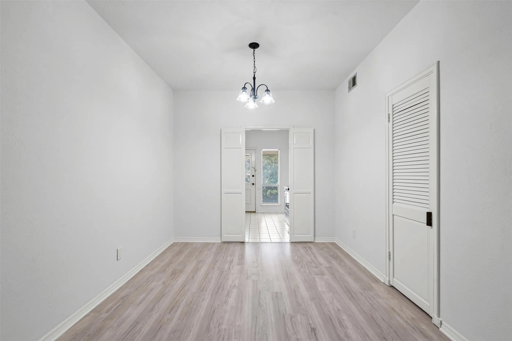 Dining area looking into kitchen.