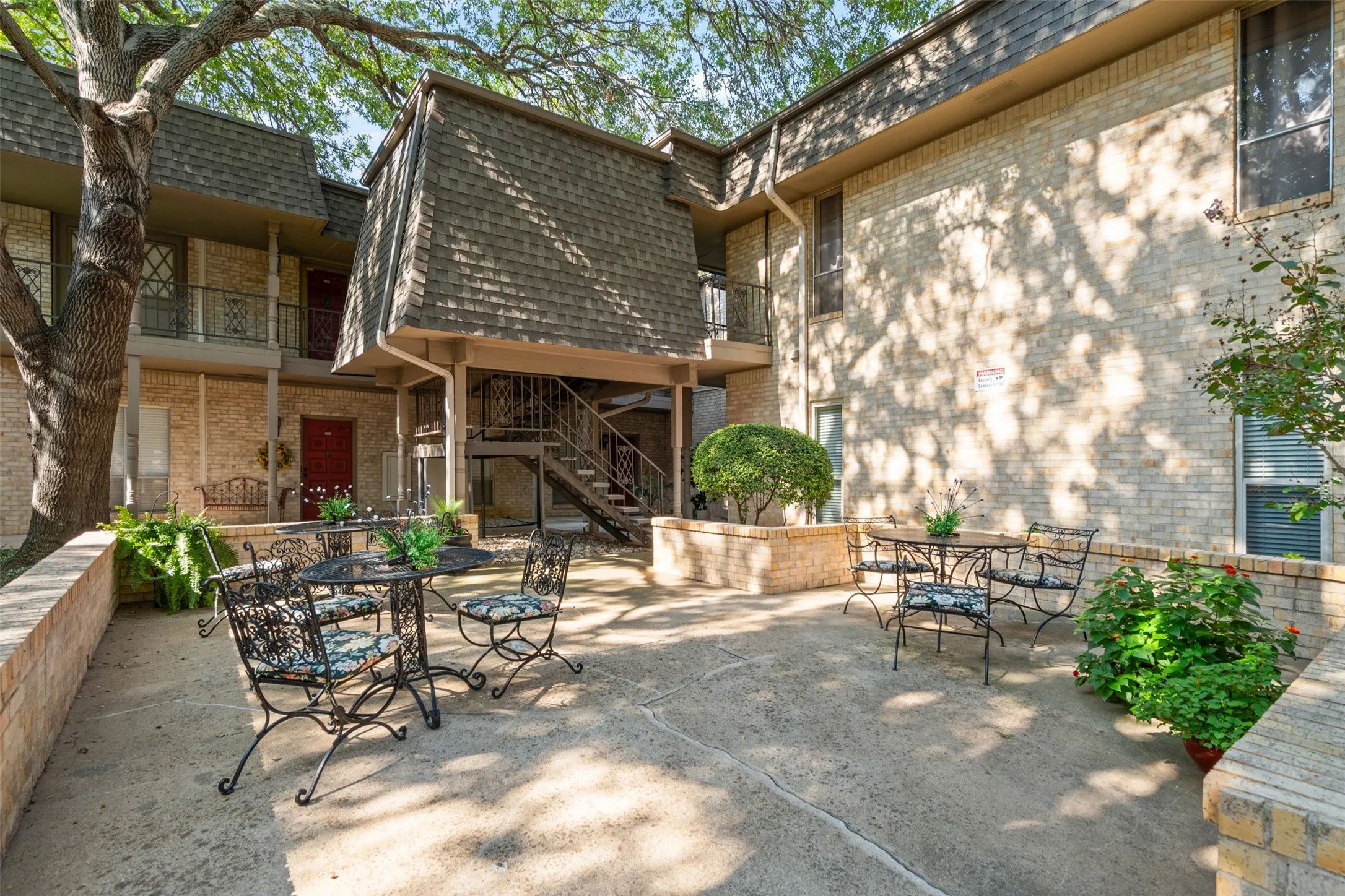 Patio/terrace sitting area just outside front entry of condo.