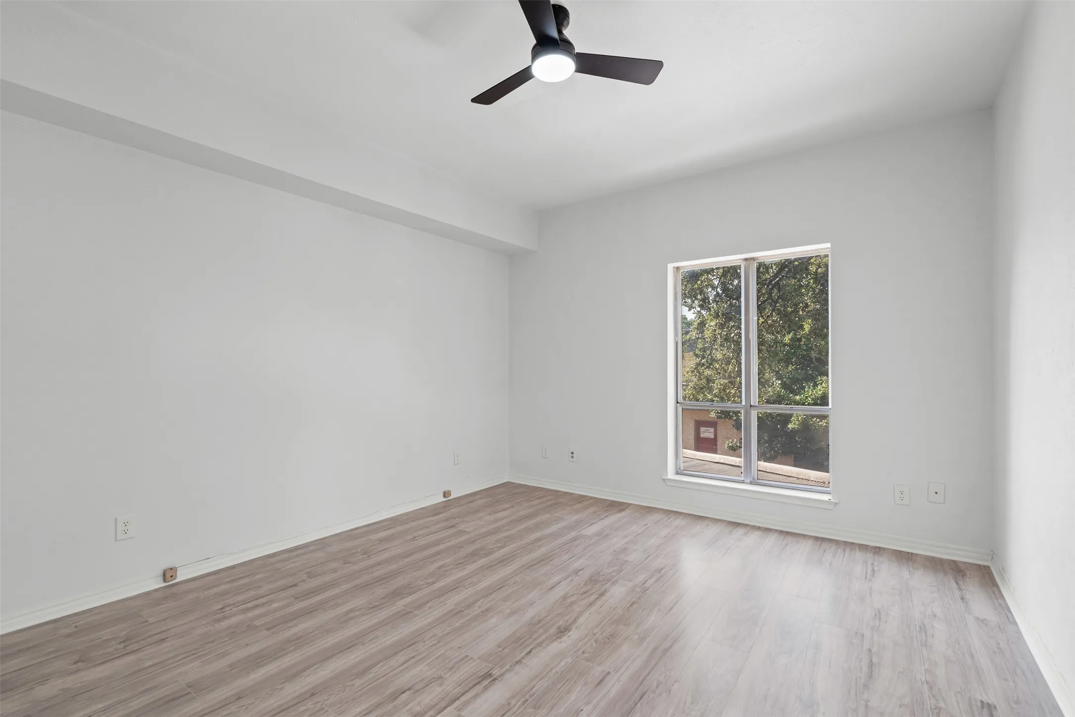 Bedroom with new LVP flooring.