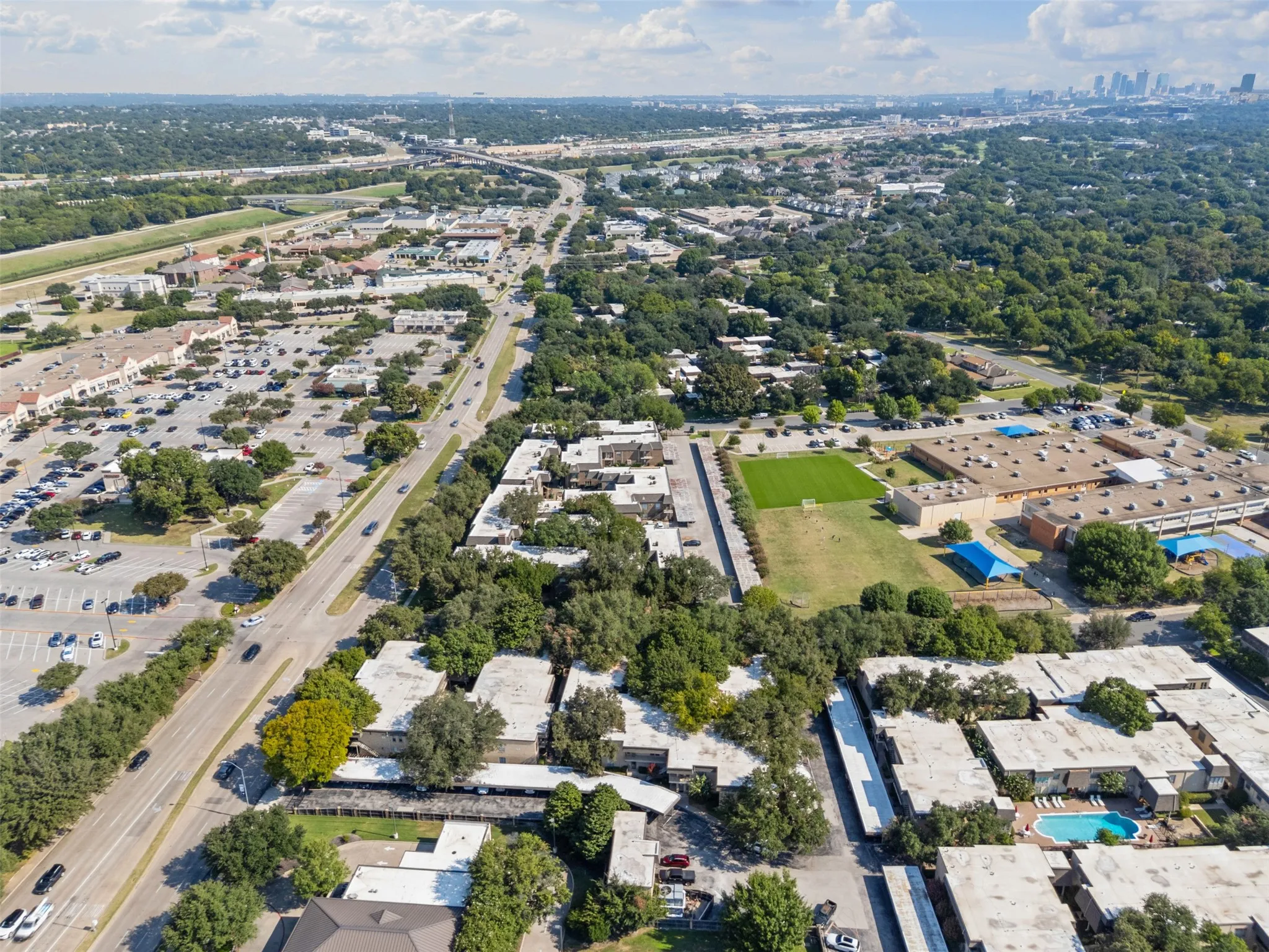 Aerial view of the surrounding neighborhood and shopping center.