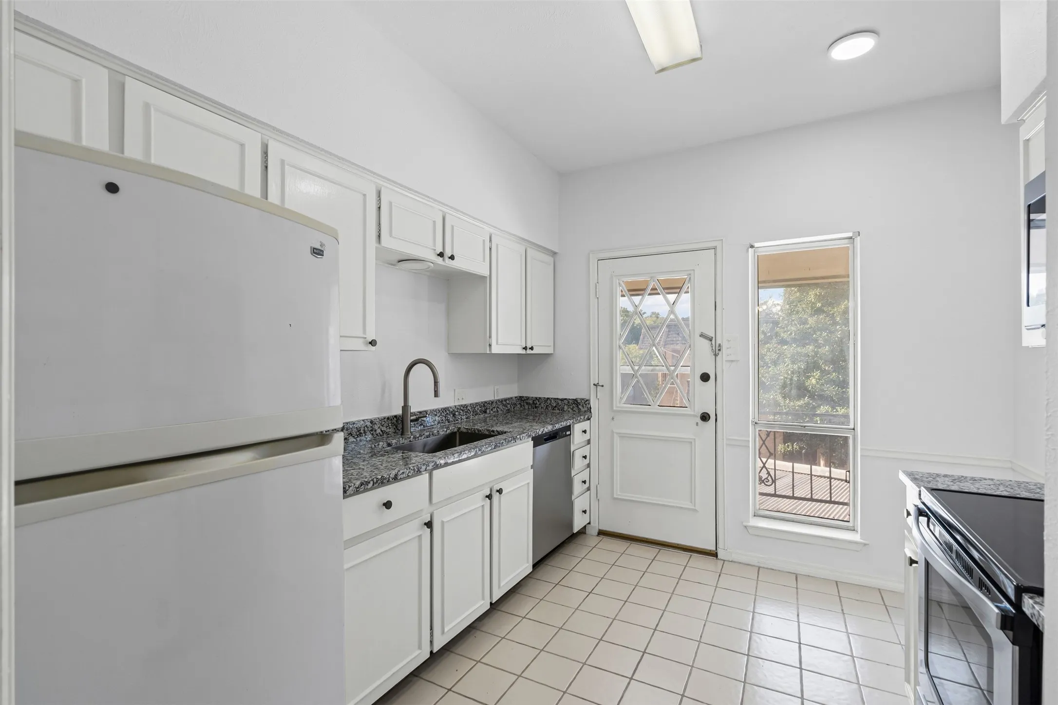 Kitchen with new granite countertops.