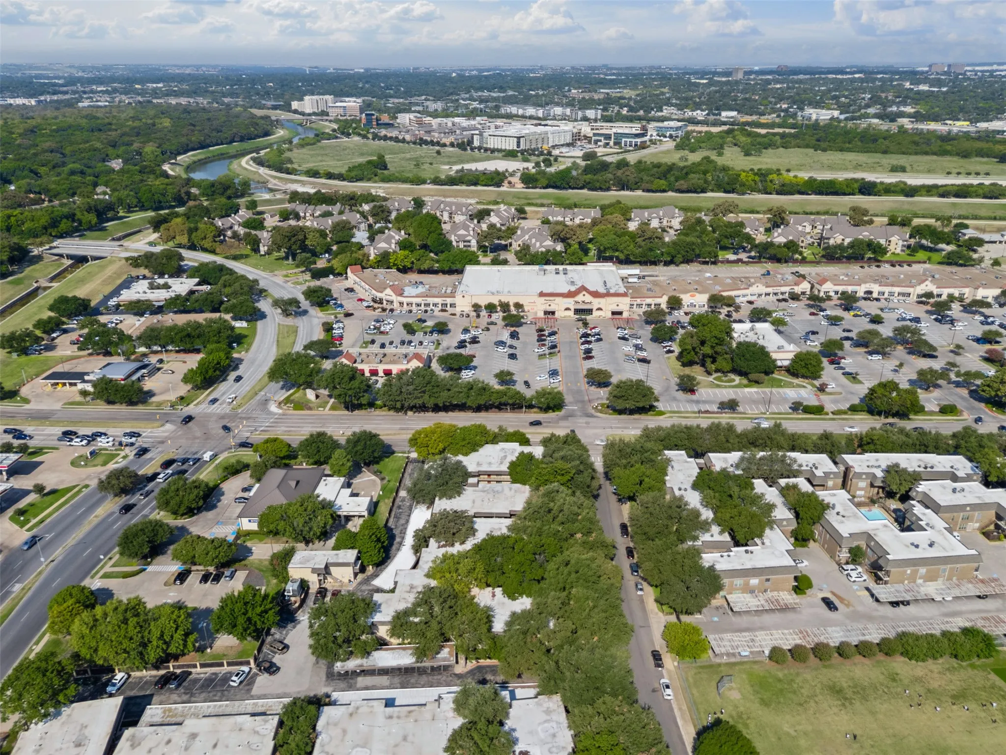 Aerial view where you can see the close proximity to shopping and the Trinity River walking trails.