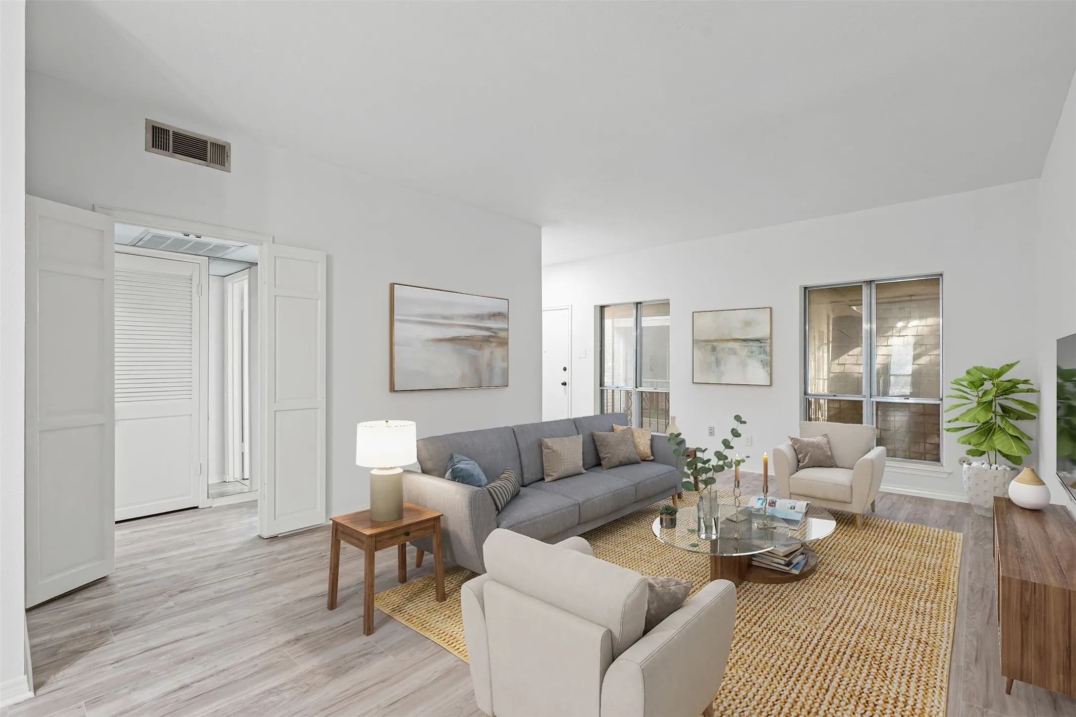 Virtually staged living room to see the amazing potential this condo has.