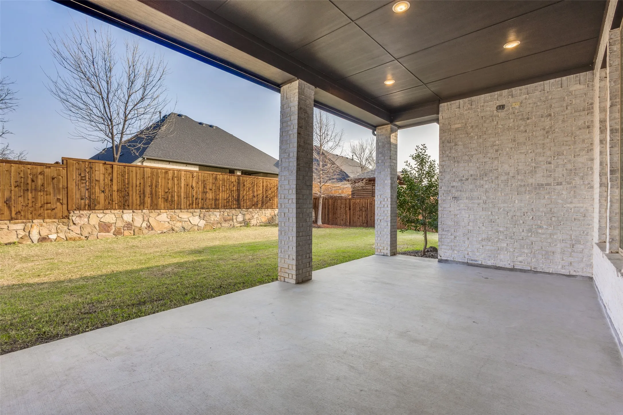 Fenced backyard featuring a patio area
