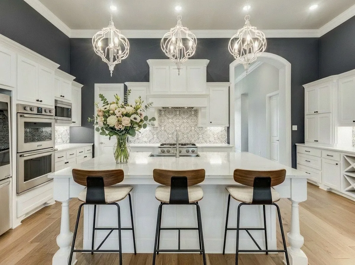 Kitchen featuring white cabinetry, stainless steel appliances, an island with sink, light hardwood flooring, and decorative backsplash.  AI staged photo