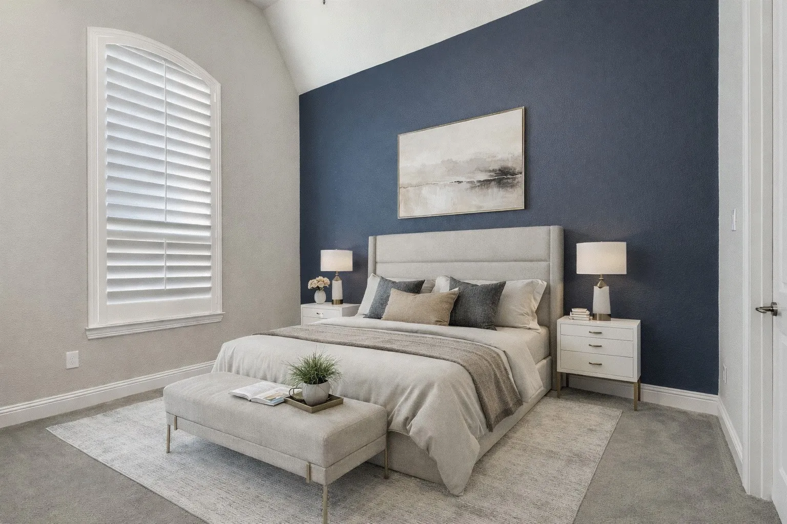 Carpeted bedroom with vaulted ceiling and an accent wall.  AI staged photo.