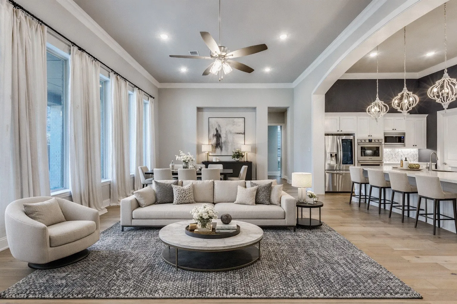 Living room with light wood finished floors, ornamental molding, ceiling fan, and high ceilings.  AI staged photo