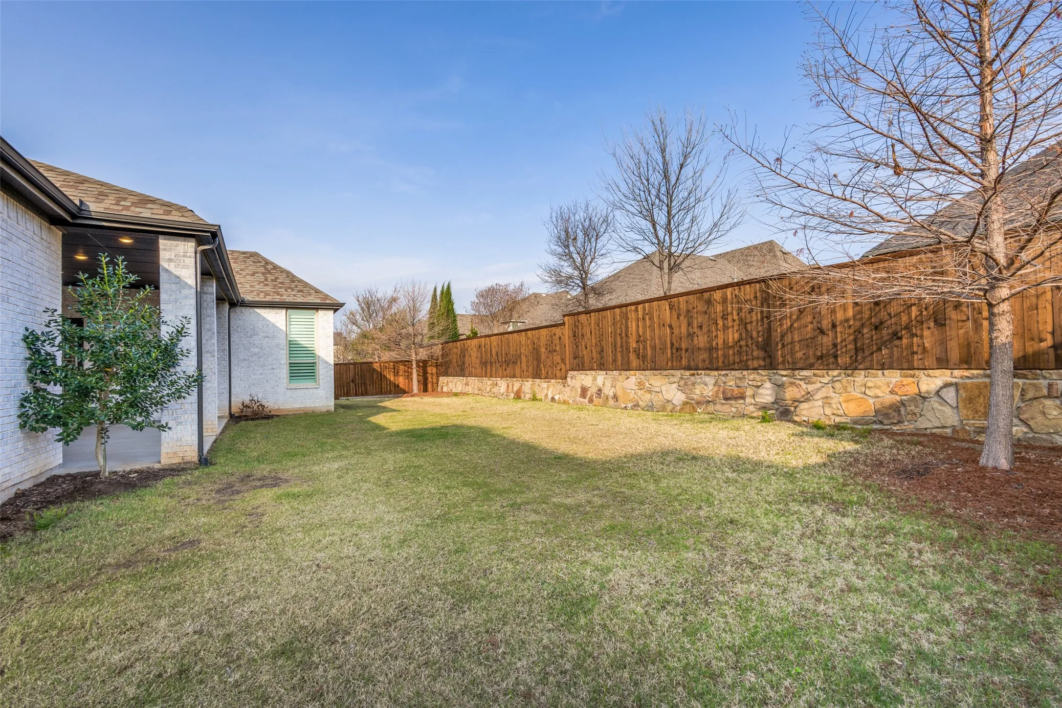 View of fenced backyard
