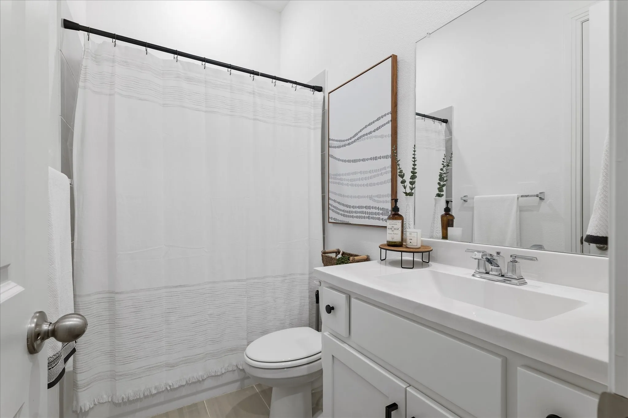 Full bathroom featuring vanity and curtained shower