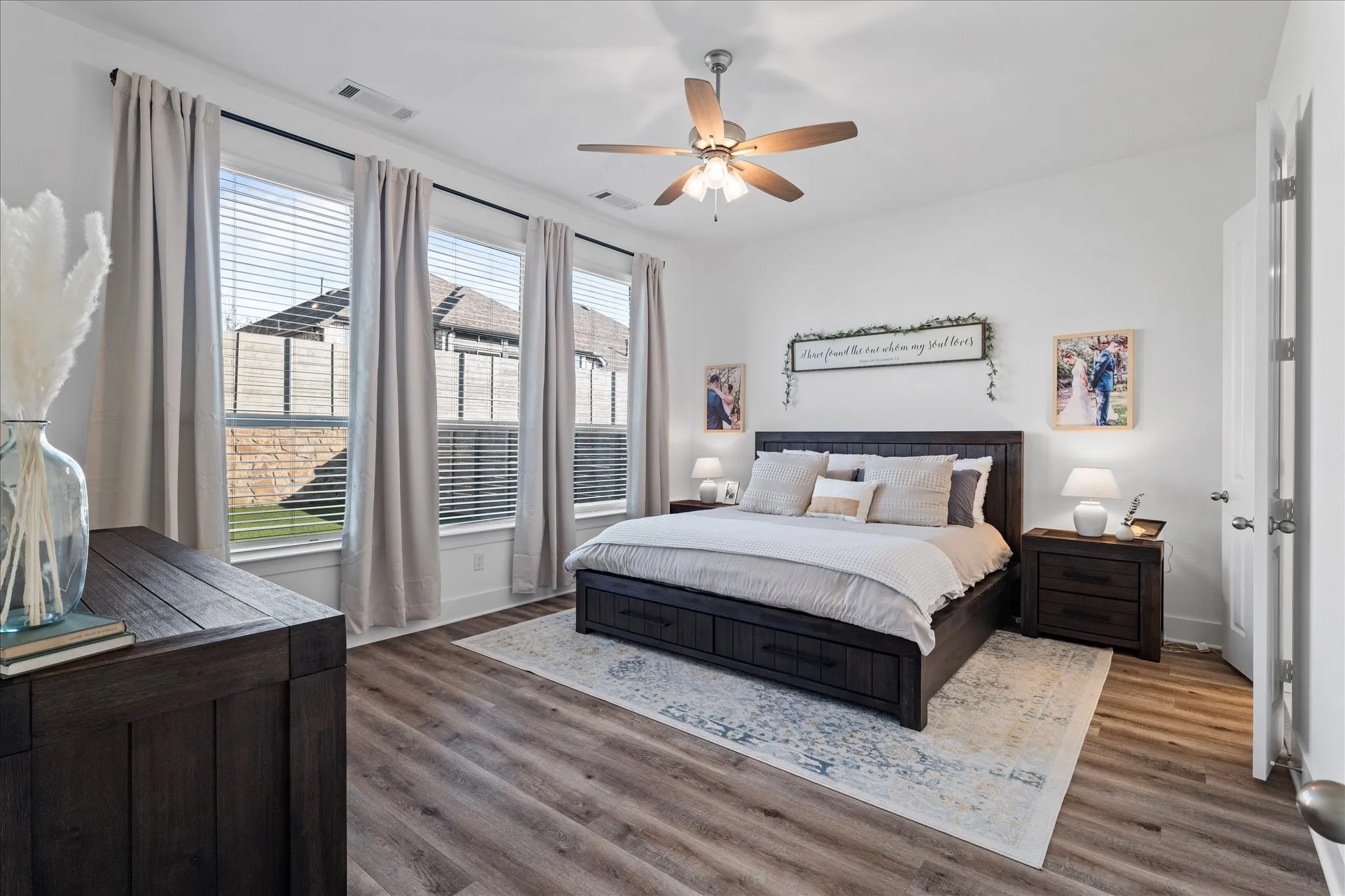 Bedroom with dark wood-type flooring and ceiling fan