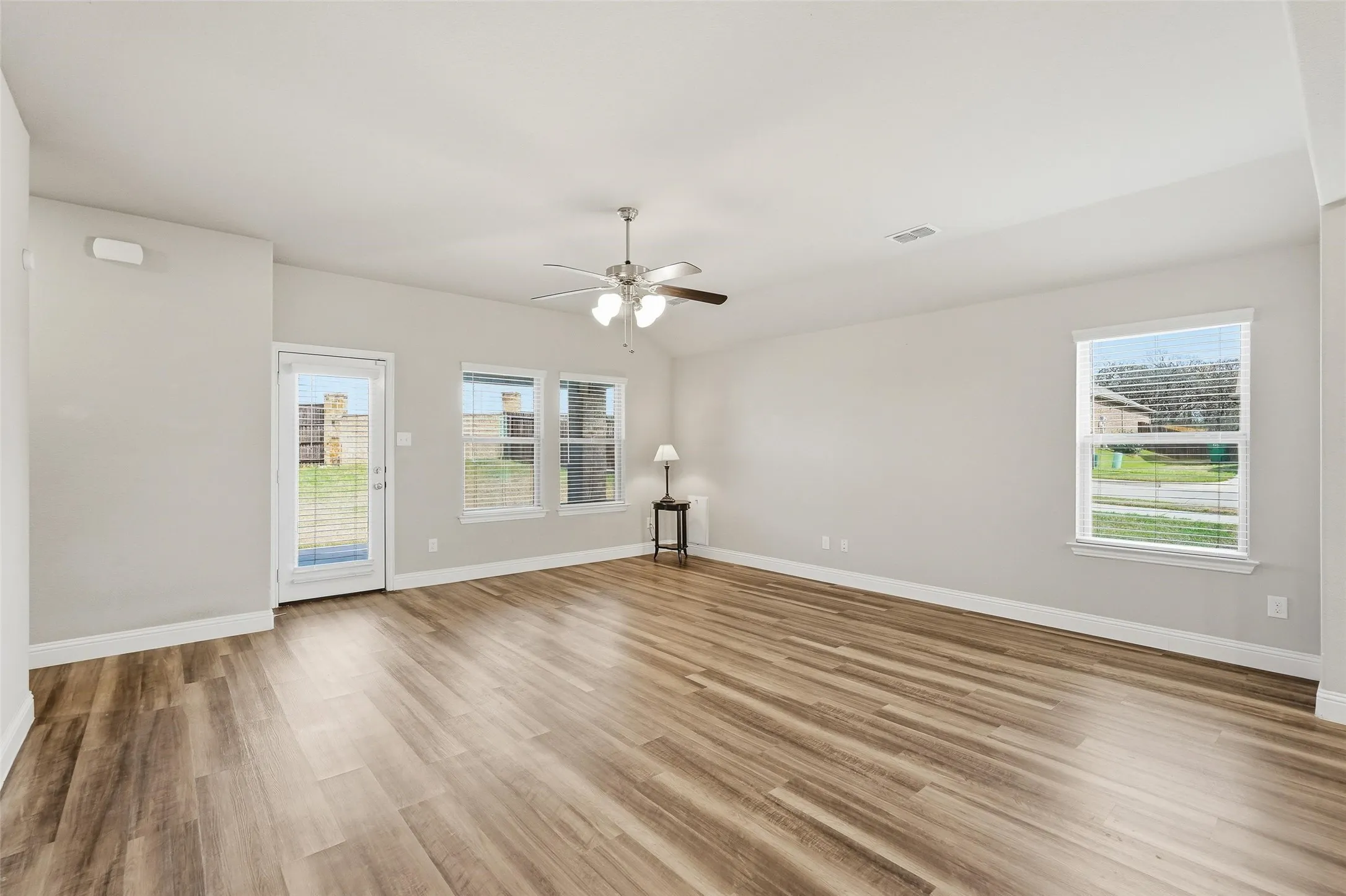 Very spacious living room that opens to the covered patio and large backyard.