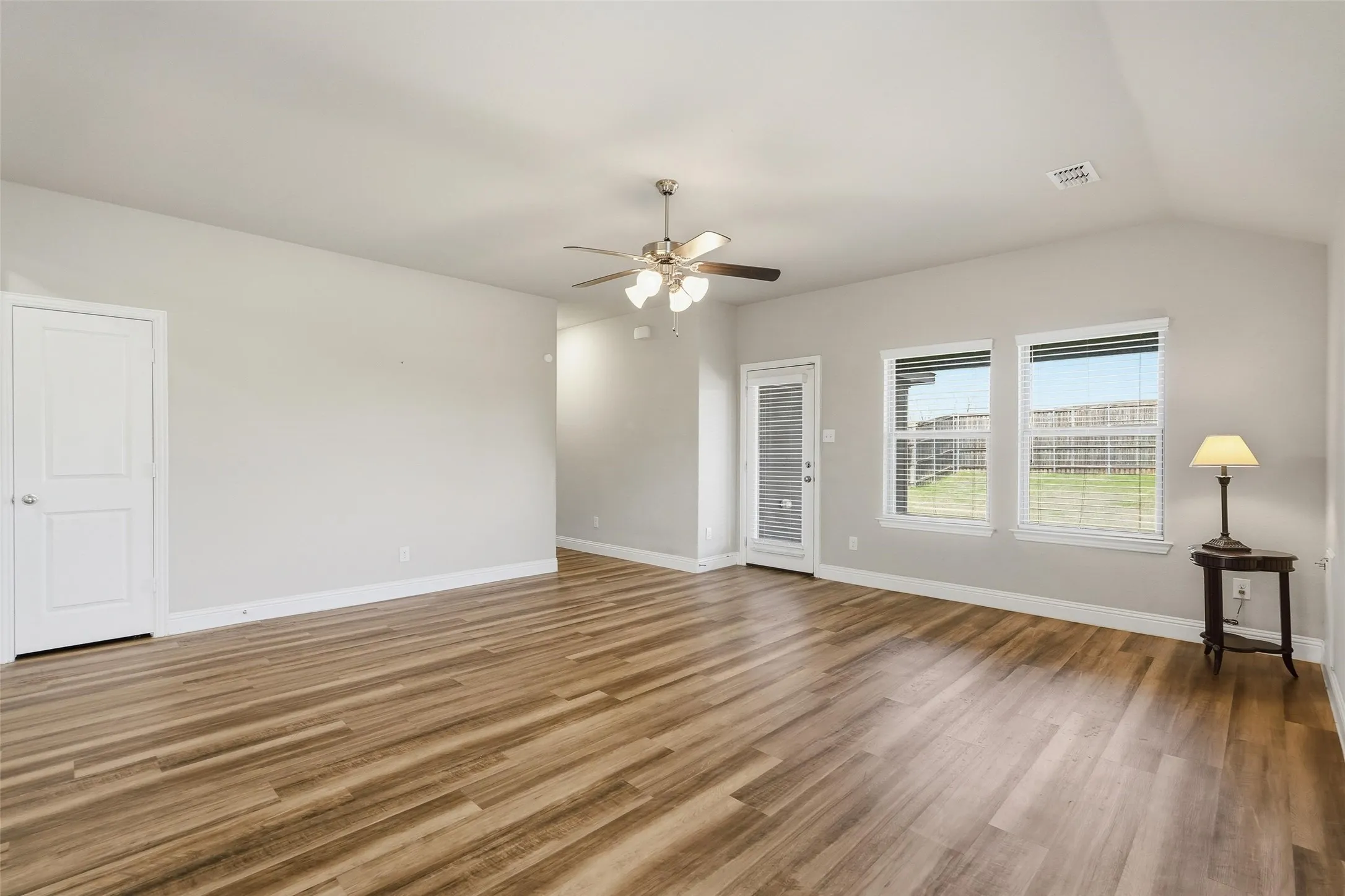 Very spacious living room that opens to the covered patio and large backyard.