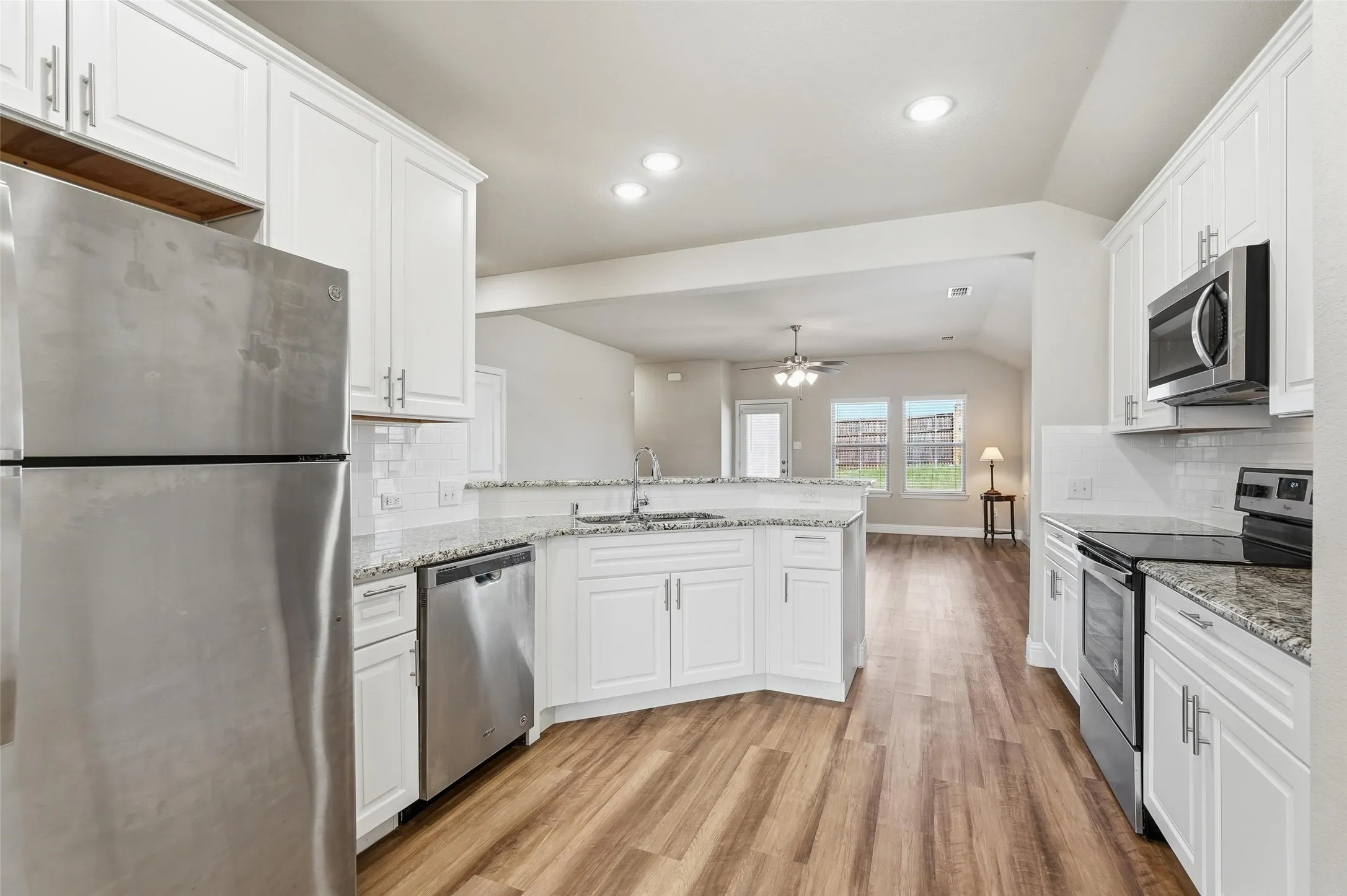 Kitchen flows easily to both the formal dining and family rooms.