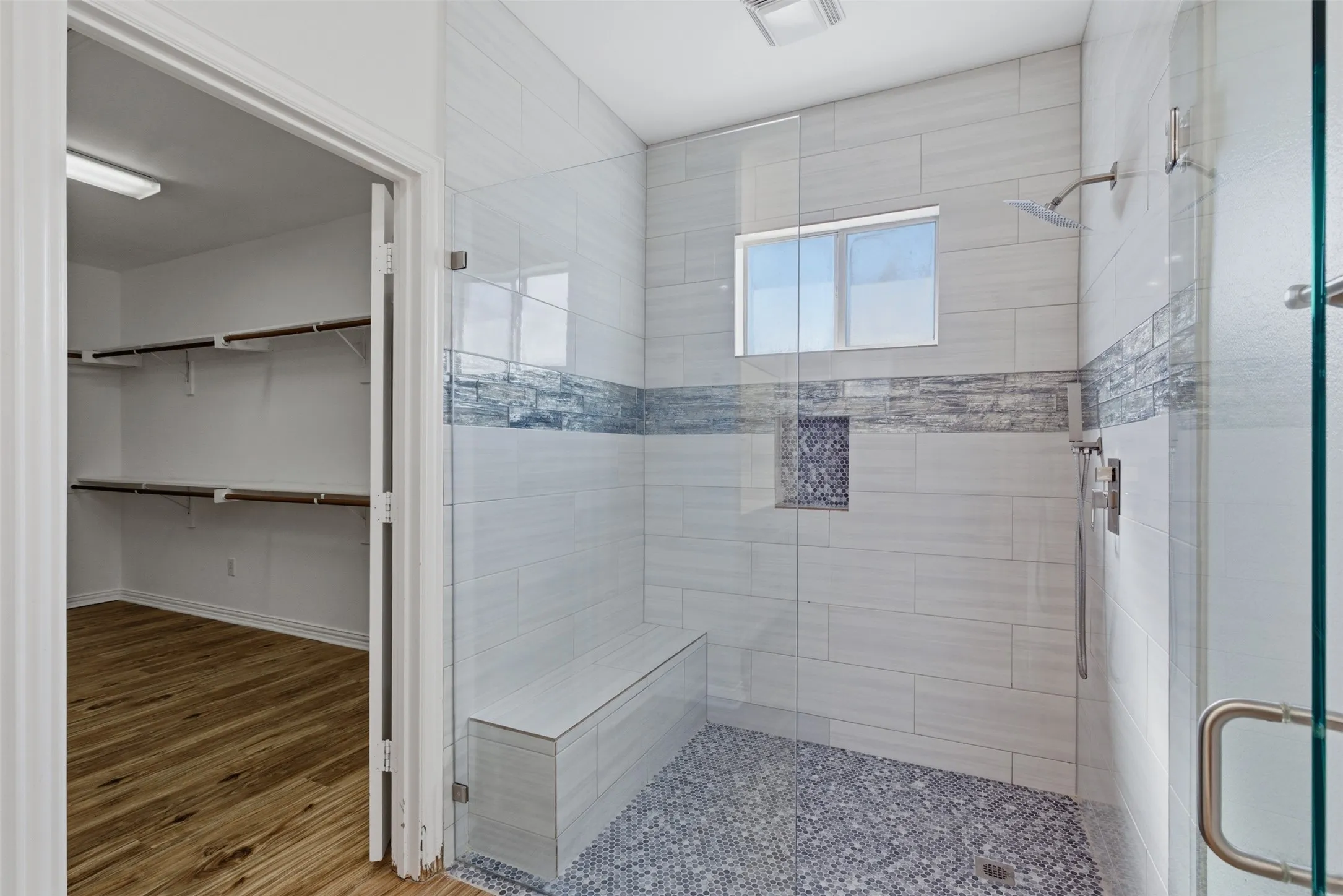 Huge primary bedroom closet and walk in shower