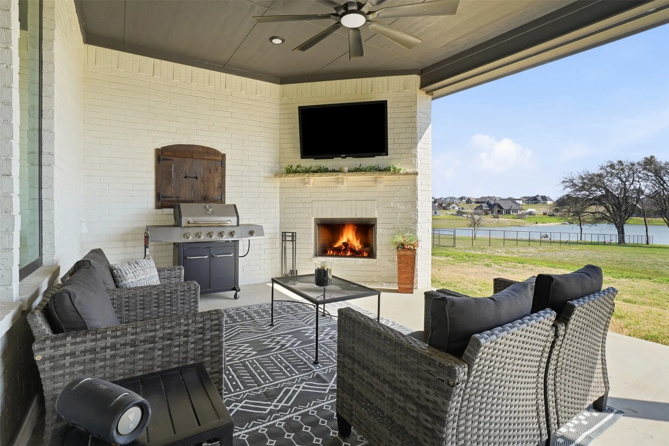 Great relaxing patio w/fireplace and views of the pond