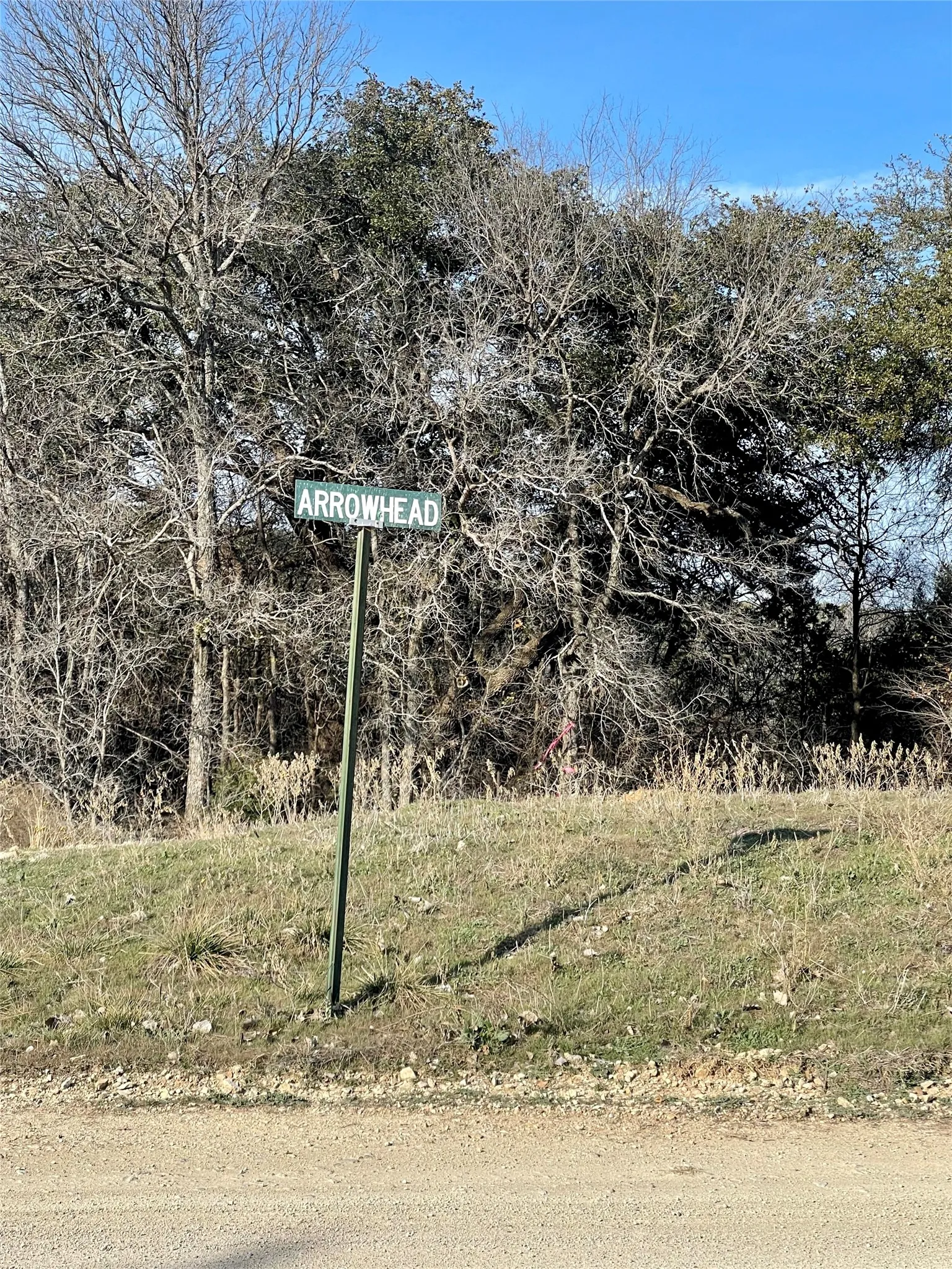 Arrowhead Rd marker - lot for sale is across the street from this sign towards lake