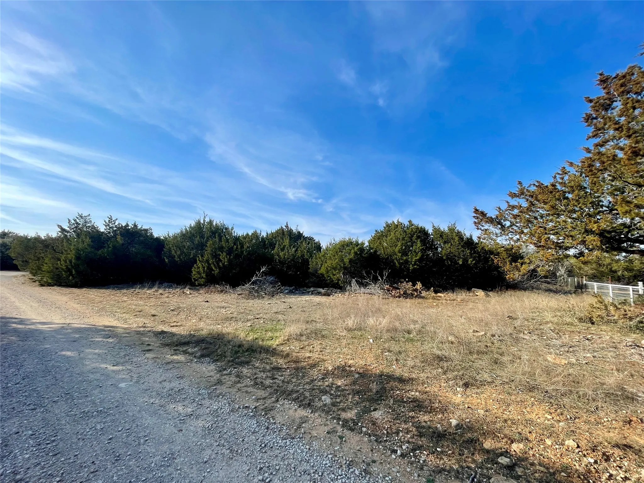 View from Arrowhead Trail to Lakeshore Lane, corner of lot