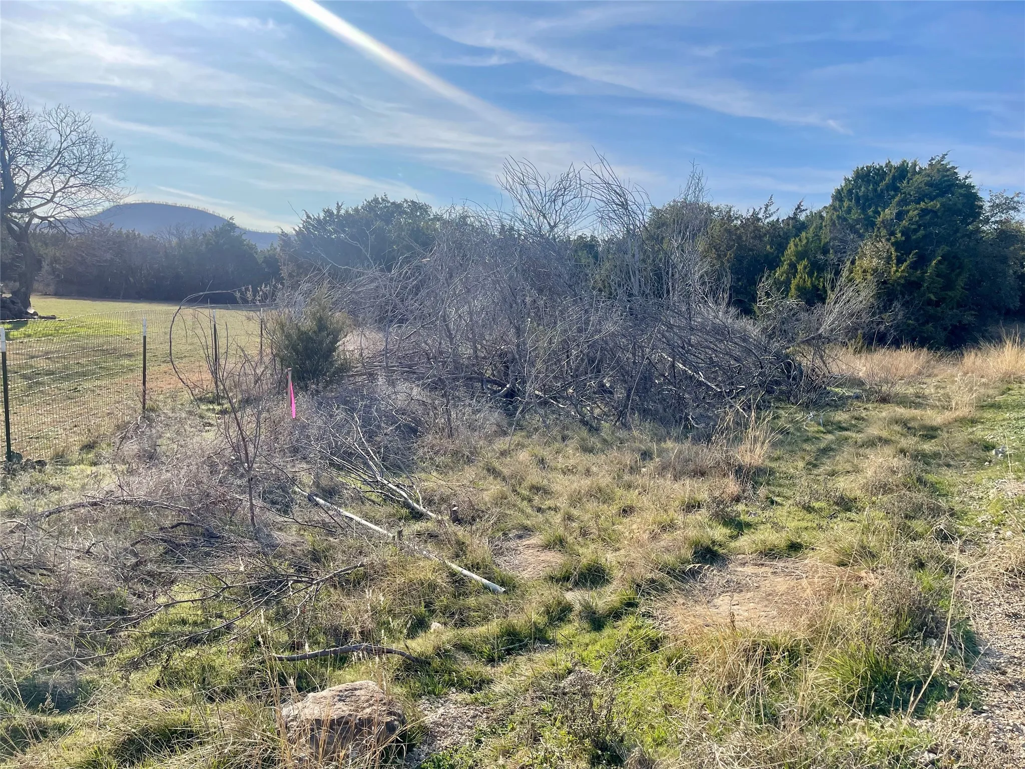 Corner stake along back fence of neighboring lot - view from Arrowhead Road