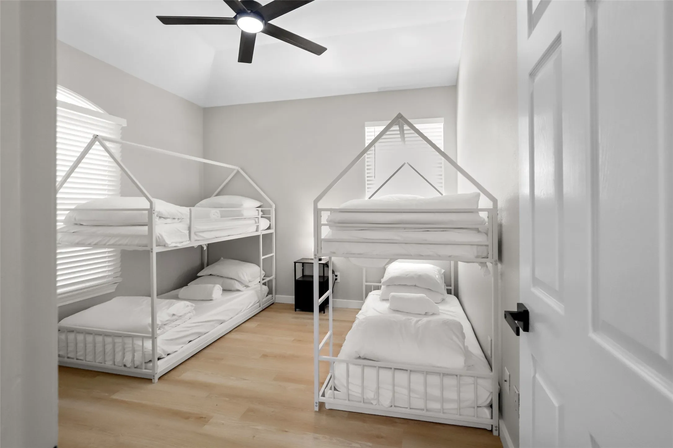 Bedroom featuring wood finished floors and a ceiling fan