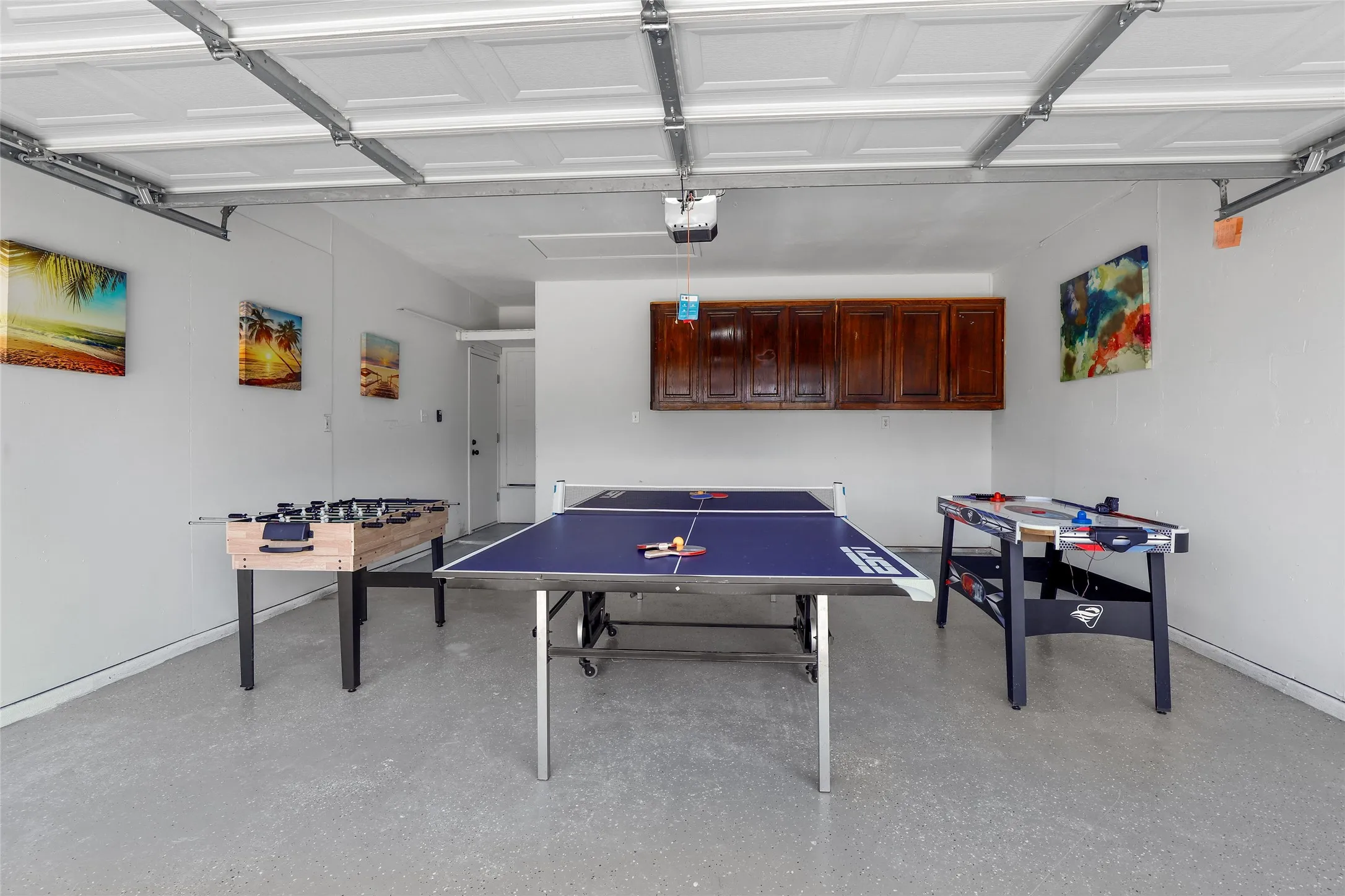 Recreation room featuring a garage