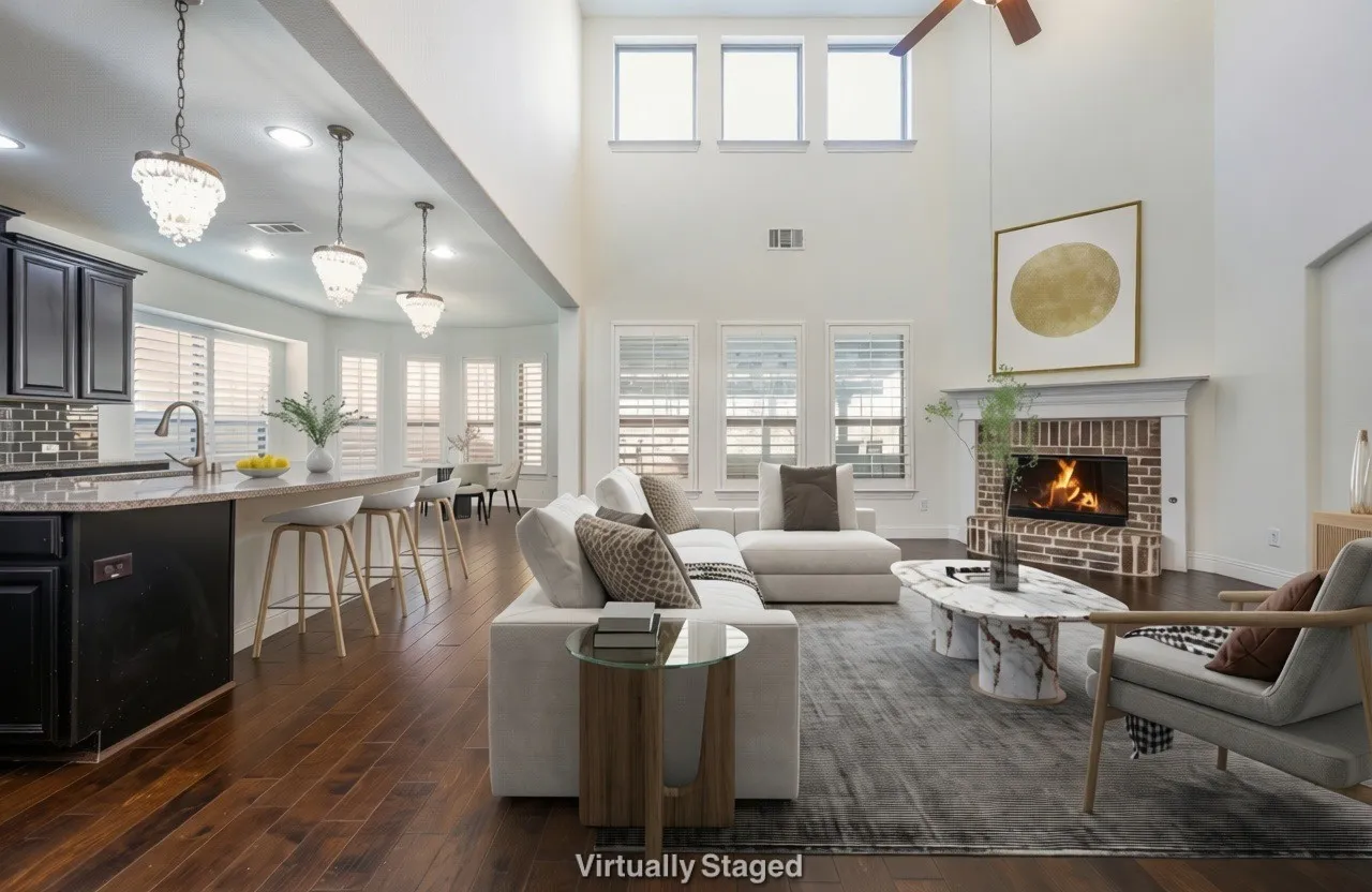 Living area featuring dark wood-type flooring, a fireplace, healthy amount of natural light, and hanging lights