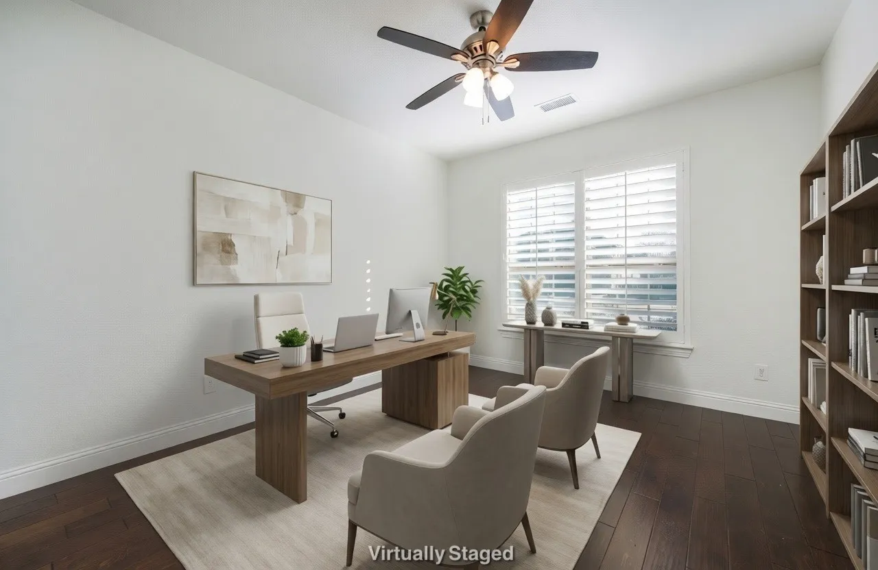 Home office with a ceiling fan and dark wood-type flooring