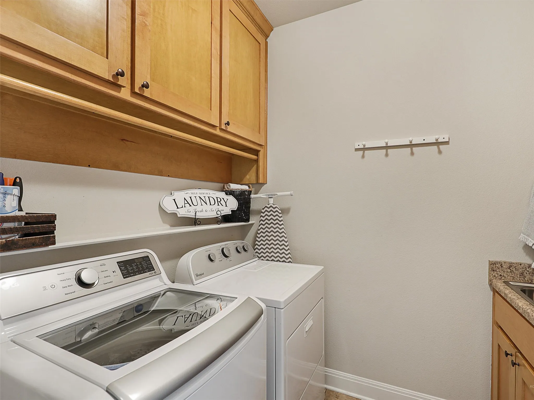 Utility Room with Maple Cabinets and a Large Work Sink