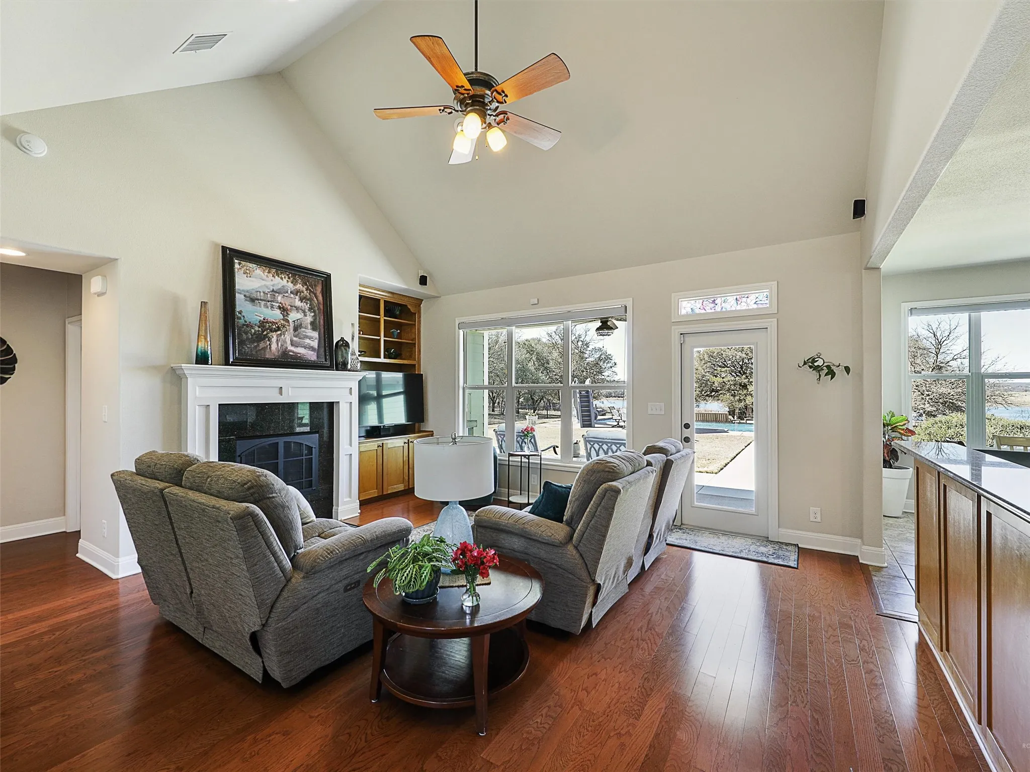 Open Living with Oak Flooring, Cathedral Ceilings and Picture Windows offering a Wonderful View of Your Pool, the Community Lake and the Wide Open Spade that is Your Backyard!