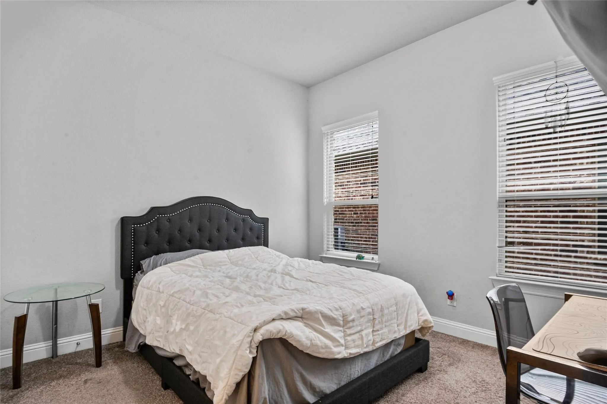 Carpeted bedroom with baseboards