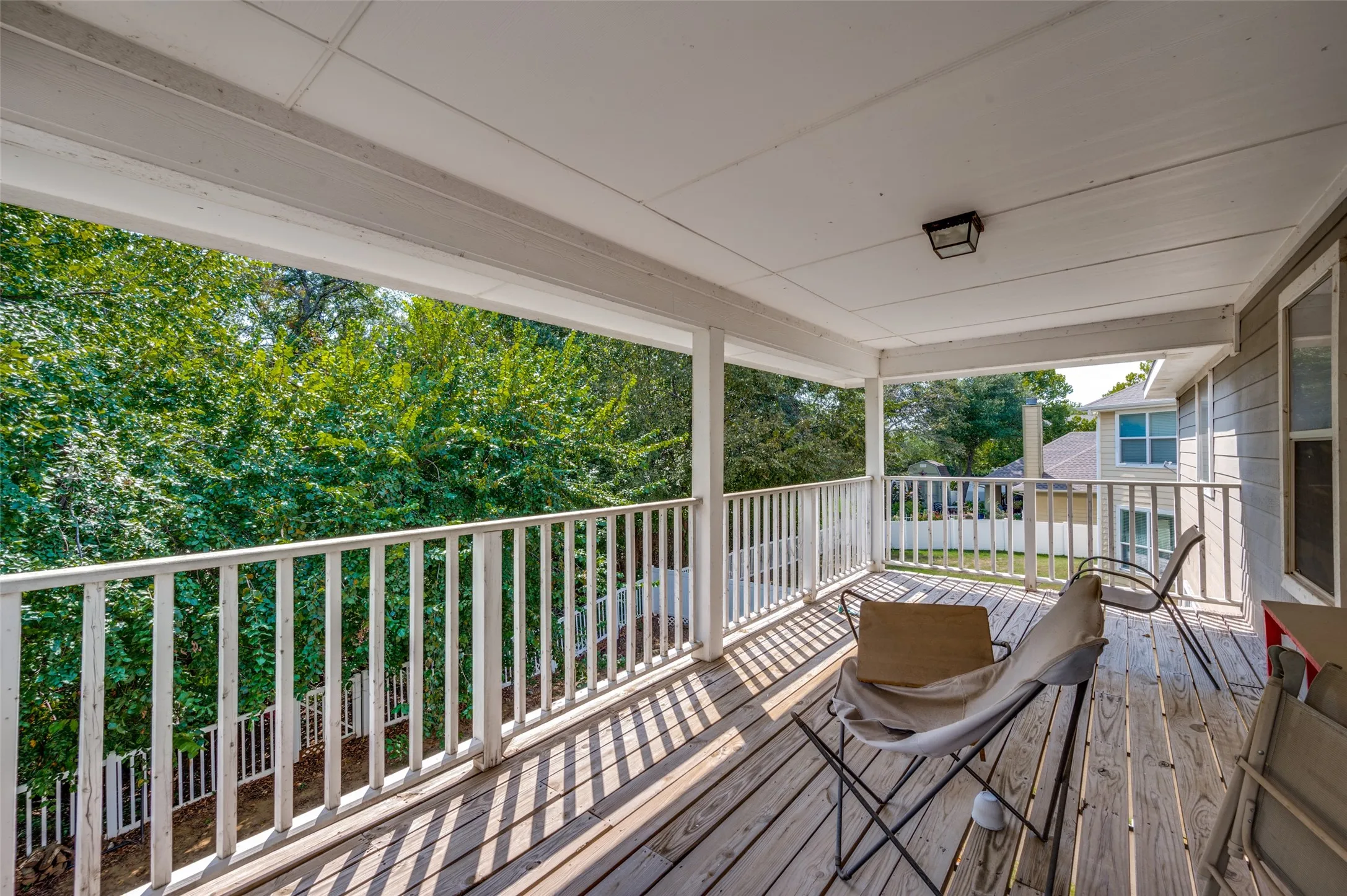 Spacious back patio over looks the private backyard.