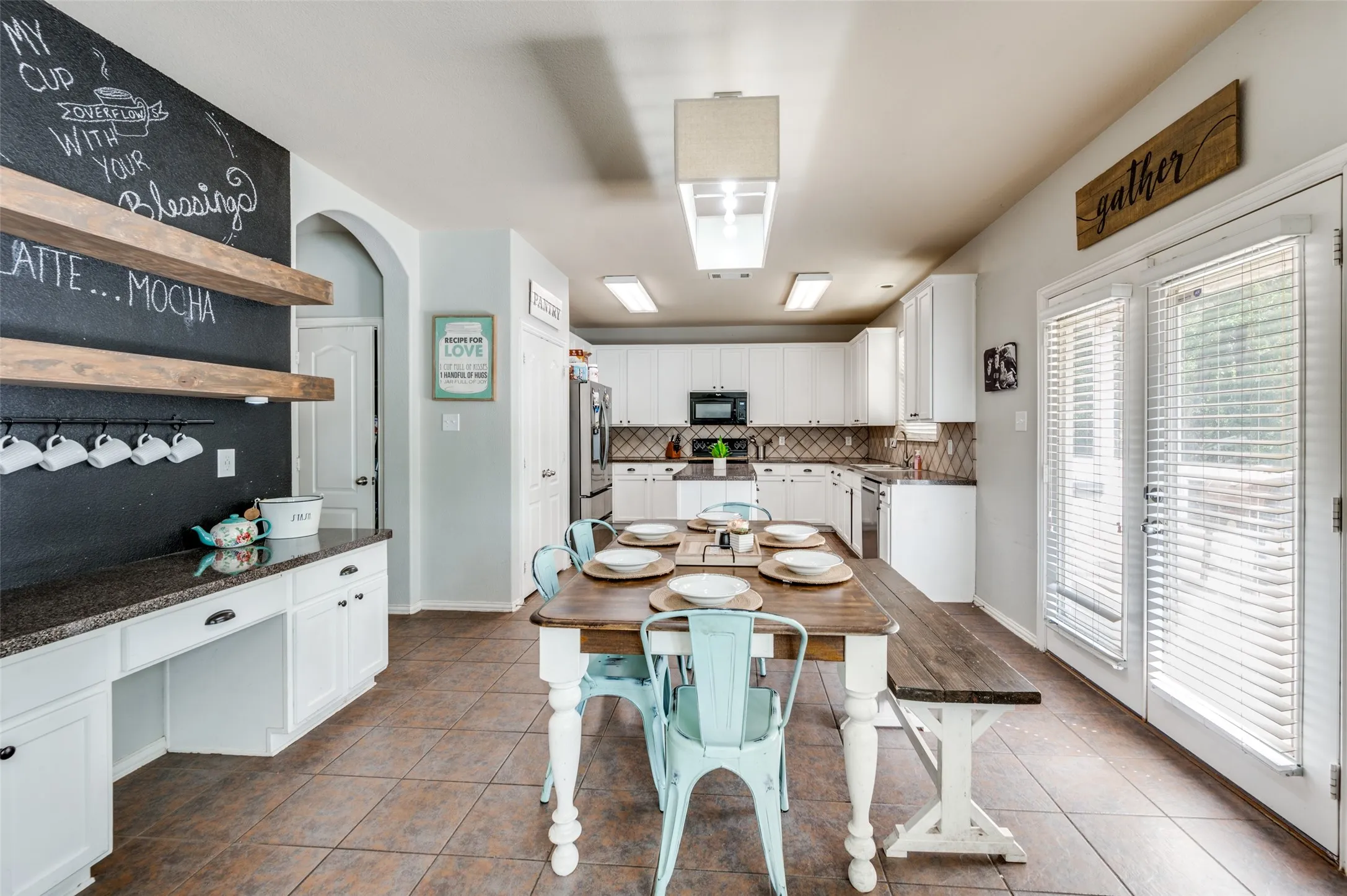 Dining area is just off the kitchen and separates the living and kitchen. Overlooks the backyard.
