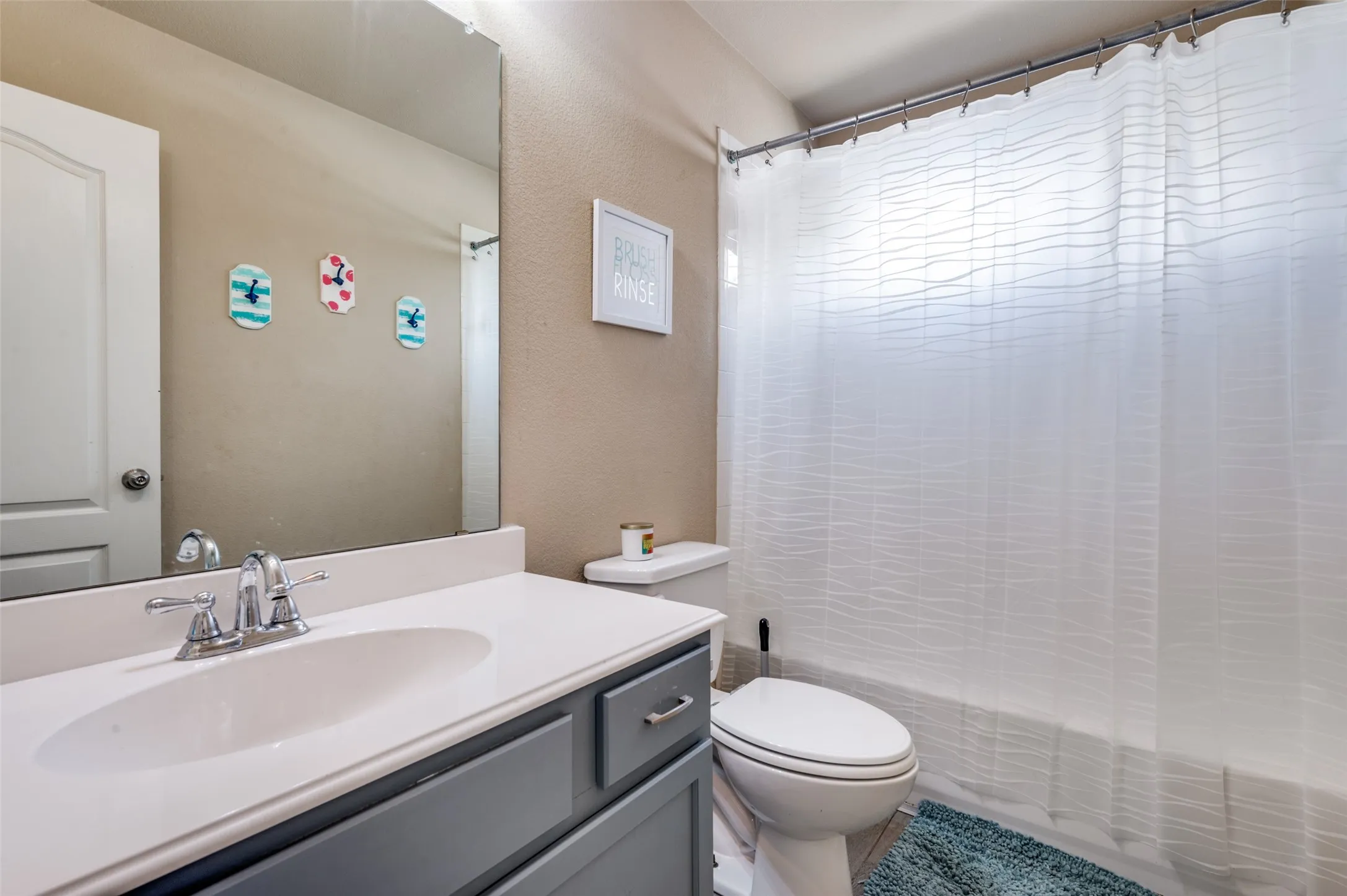 Secondary bathroom, one of three full bathrooms.