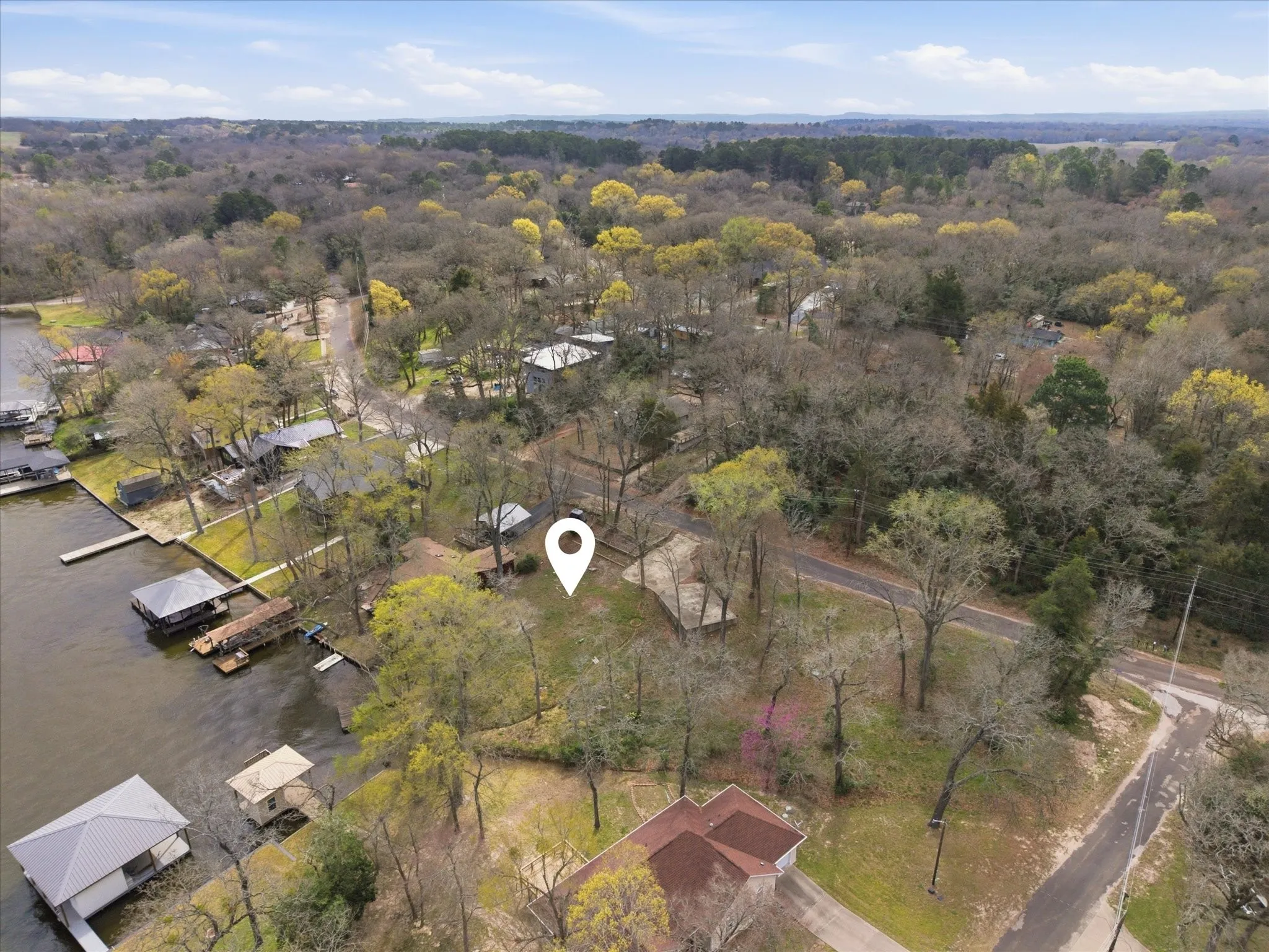 Nestled among mature trees, your lake home fits here!
