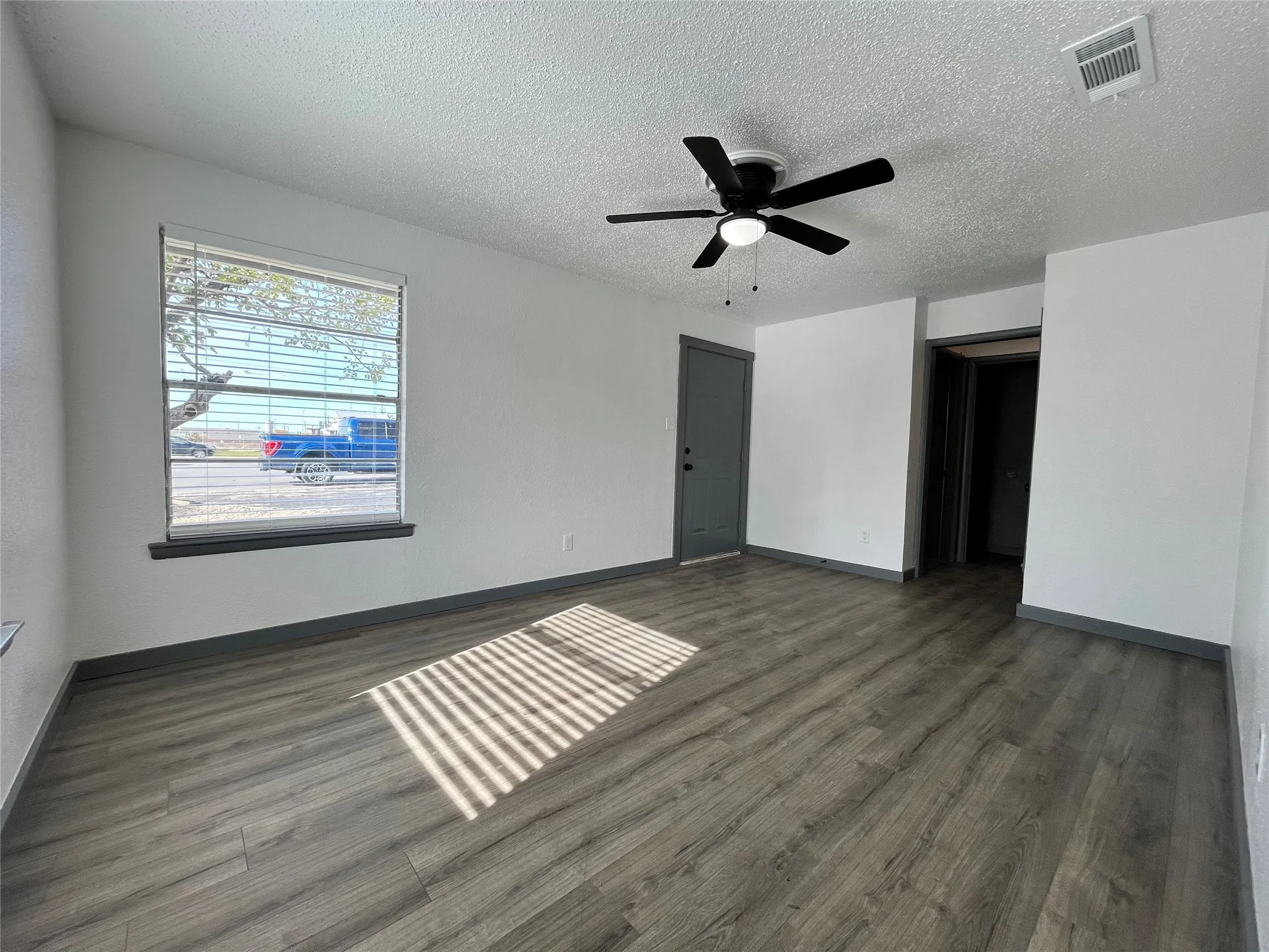 This unit is finished with brand new flooring, everything has a fresh coat of paint, and lighted fans are all new installs.