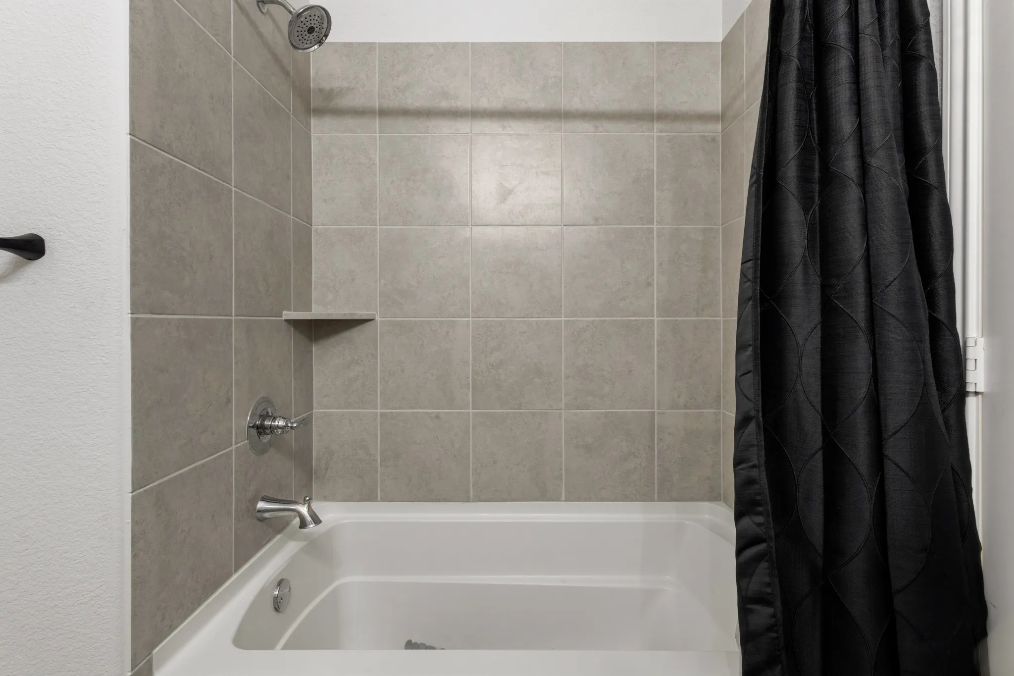 Bathroom featuring shower / tub combo