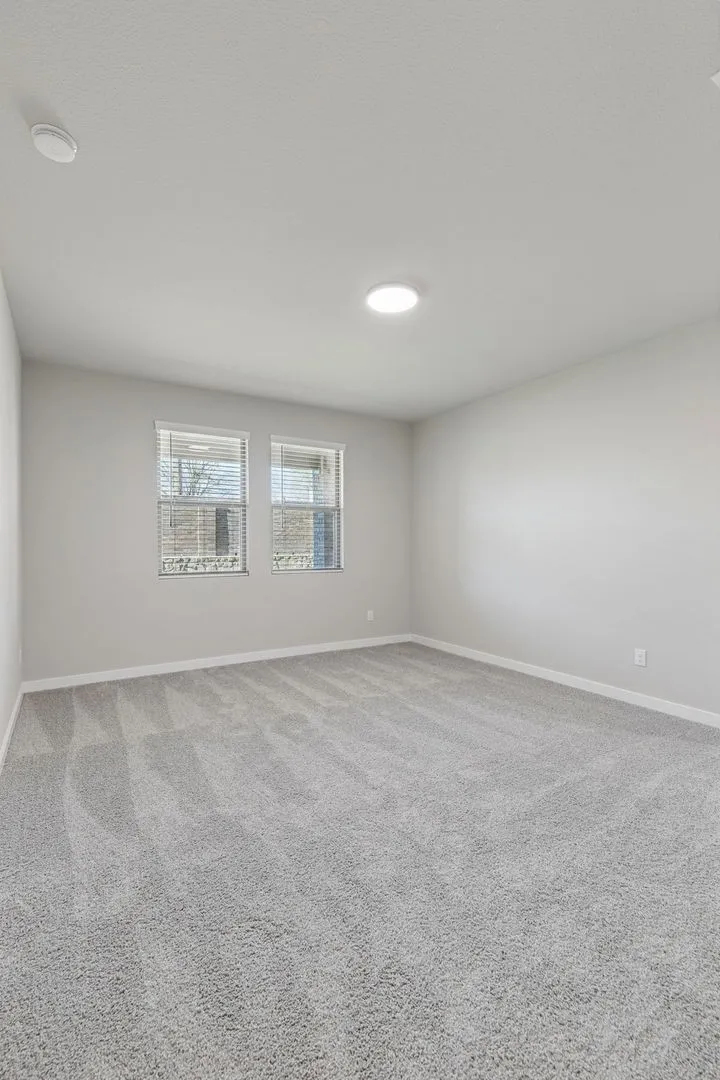 Primary Suite in the Holden home plan by Trophy Signature Homes – REPRESENTATIVE PHOTO