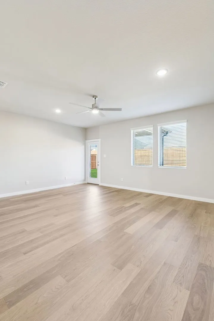 Living Room in the Haylee home plan by Trophy Signature Homes - REPRESENTATIVE PHOTO